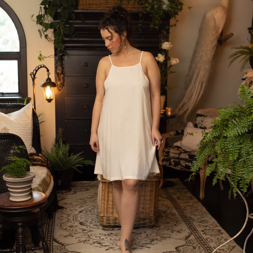 Model wearing the Étoile Simple Slip in soft natural viscose – perfect for layering under Market of Stars dresses, adding comfort and coverage – Market of Stars.