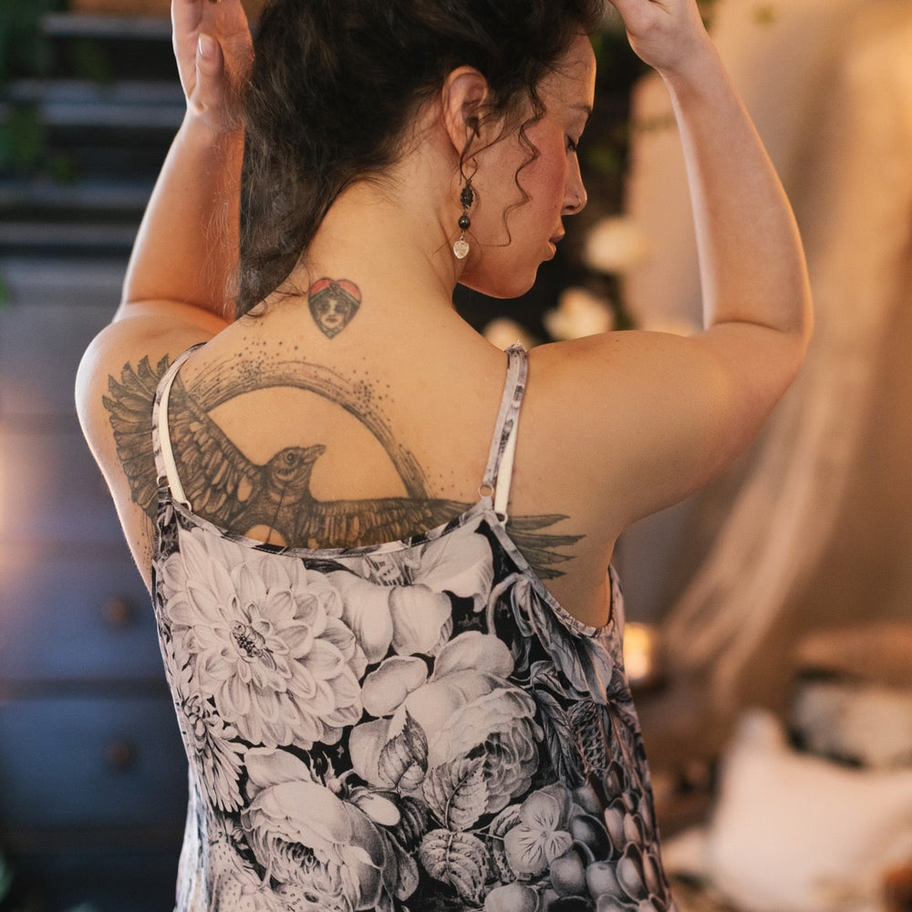 
                  
                    Model wearing the Étoile Simple Slip in soft natural viscose – perfect for layering under Market of Stars dresses, adding comfort and coverage – Market of Stars.
                  
                