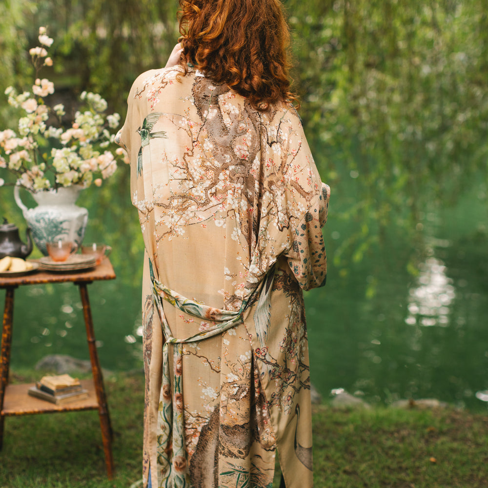 
                  
                    Model wearing Fable Opera Duster featuring antique Japanese art, cherry and peach blossoms, nightingales, deer, and French block prints - Market of Stars
                  
                