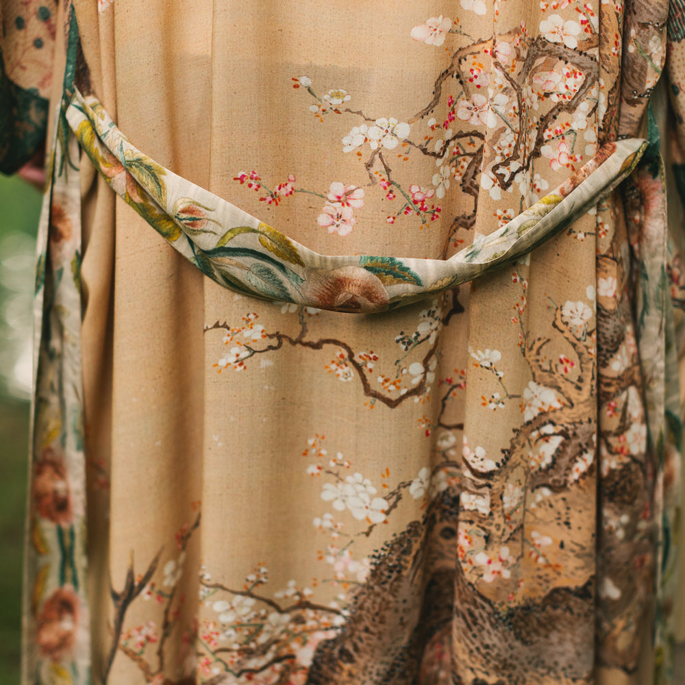
                  
                    Model wearing Fable Opera Duster featuring antique Japanese art, cherry and peach blossoms, nightingales, deer, and French block prints - Market of Stars
                  
                