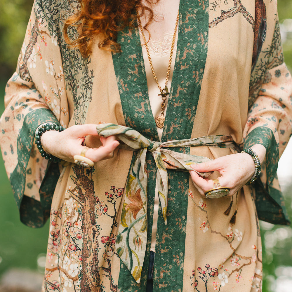 
                  
                    Model wearing Fable Opera Duster featuring antique Japanese art, cherry and peach blossoms, nightingales, deer, and French block prints - Market of Stars
                  
                