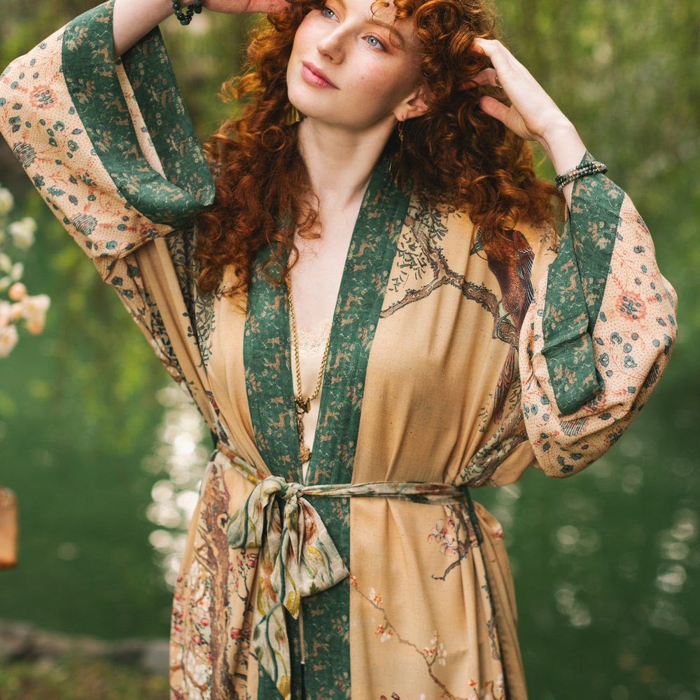 
                  
                    Model wearing Fable Opera Duster featuring antique Japanese art, cherry and peach blossoms, nightingales, deer, and French block prints - Market of Stars
                  
                