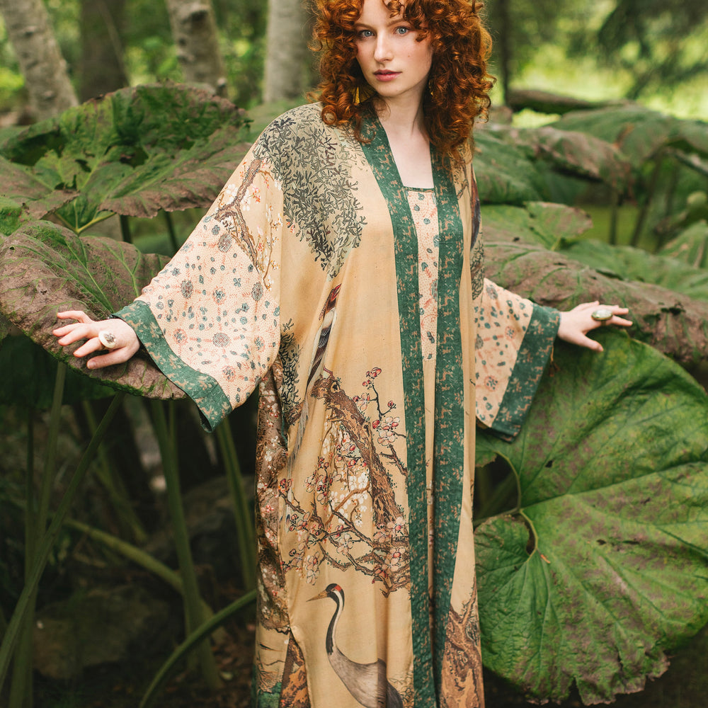 
                  
                    Model wearing Fable Opera Duster featuring antique Japanese art, cherry and peach blossoms, nightingales, deer, and French block prints - Market of Stars
                  
                