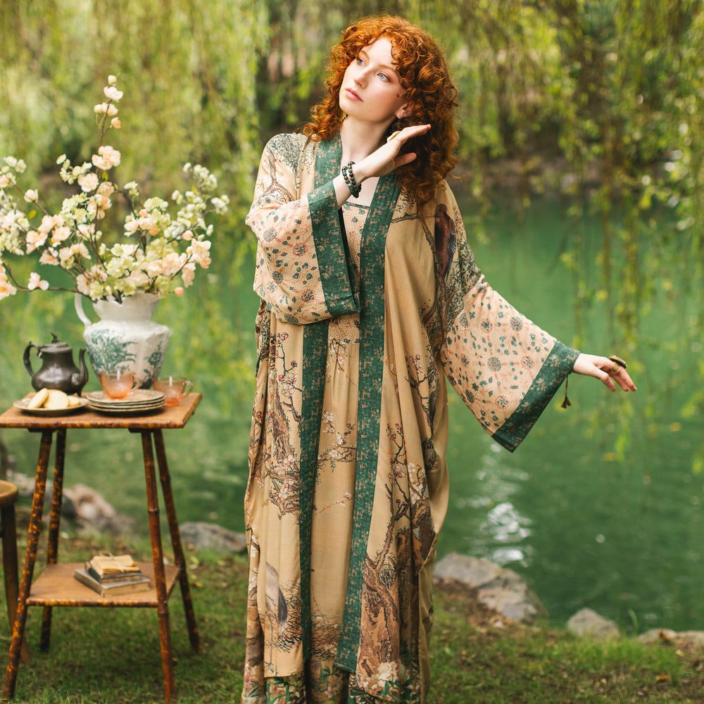 
                  
                    Model wearing Fable Opera Duster featuring antique Japanese art, cherry and peach blossoms, nightingales, deer, and French block prints - Market of Stars
                  
                