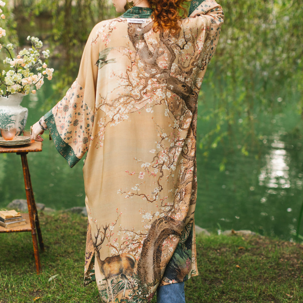 
                  
                    Model wearing Fable Opera Duster featuring antique Japanese art, cherry and peach blossoms, nightingales, deer, and French block prints - Market of Stars
                  
                