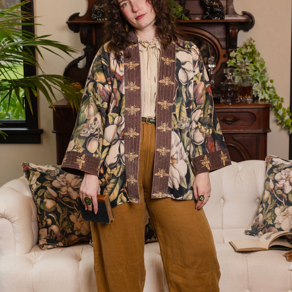 
                  
                    Model wearing a soft cotton velvet duster ft. vintage lithographs of magnolias & 1800's etchings of moths and pears - Market of Stars
                  
                