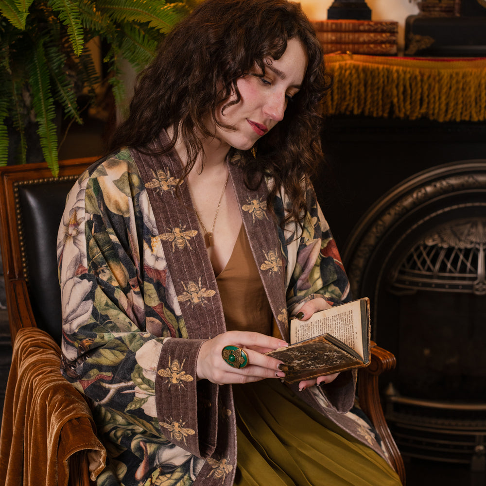 
                  
                    Model wearing a soft cotton velvet duster ft. vintage lithographs of magnolias & 1800's etchings of moths and pears - Market of Stars
                  
                