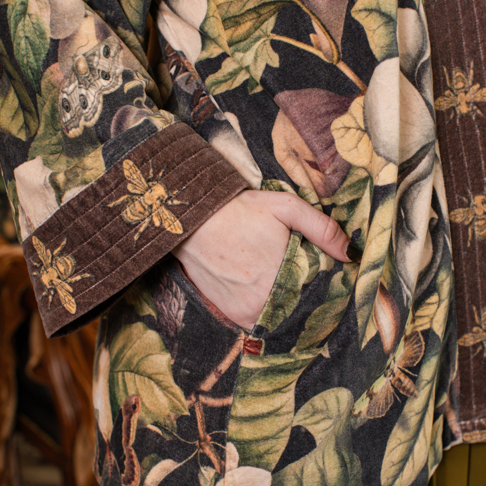 
                  
                    Model wearing a soft cotton velvet duster ft. vintage lithographs of magnolias & 1800's etchings of moths and pears - Market of Stars
                  
                