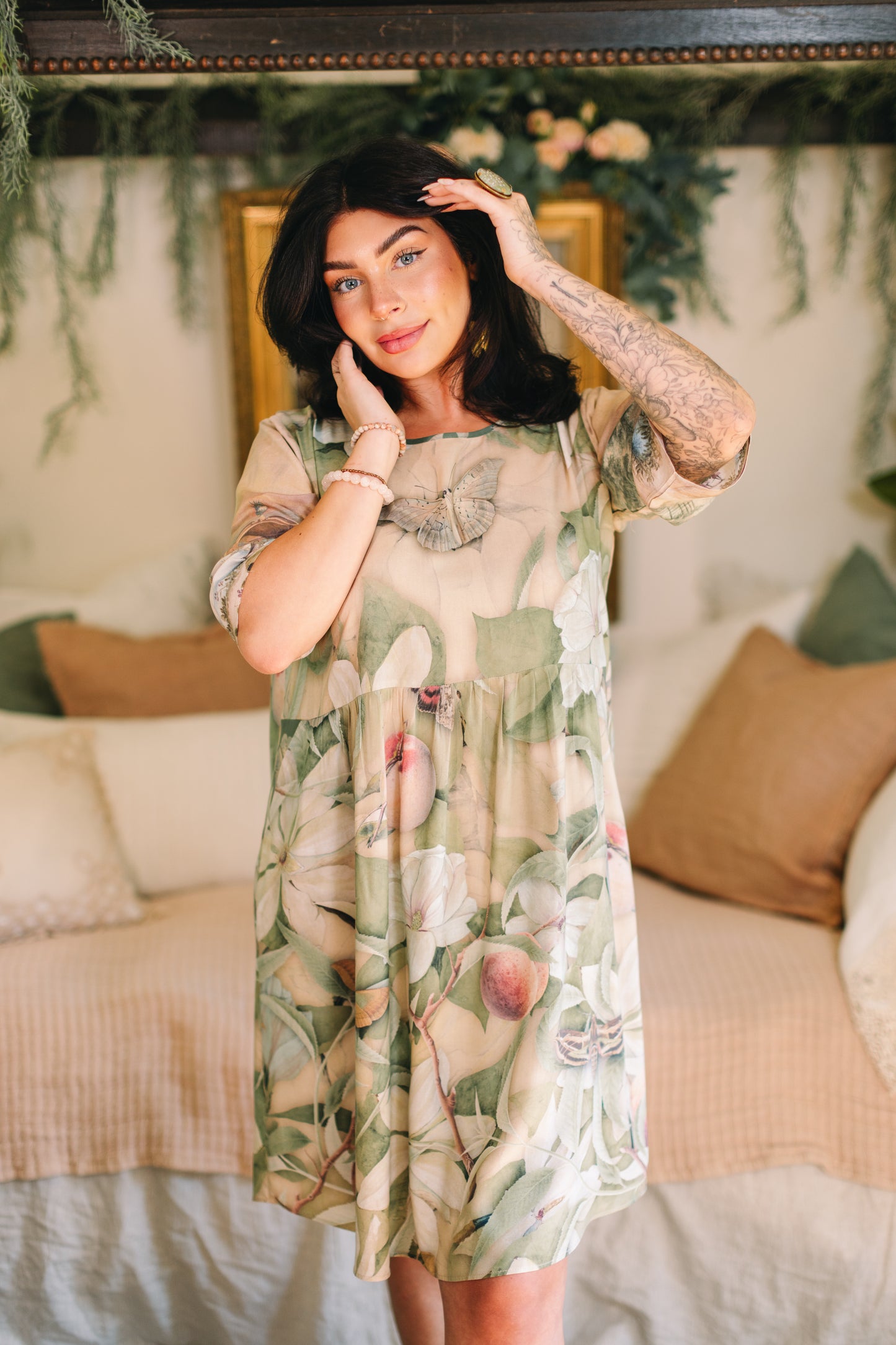 Model wearing a knee-length dress inspired by antique florals, butterflies, and sunlit gardens, this flowing duster captures the warmth and magic of golden hour - Market of Stars
