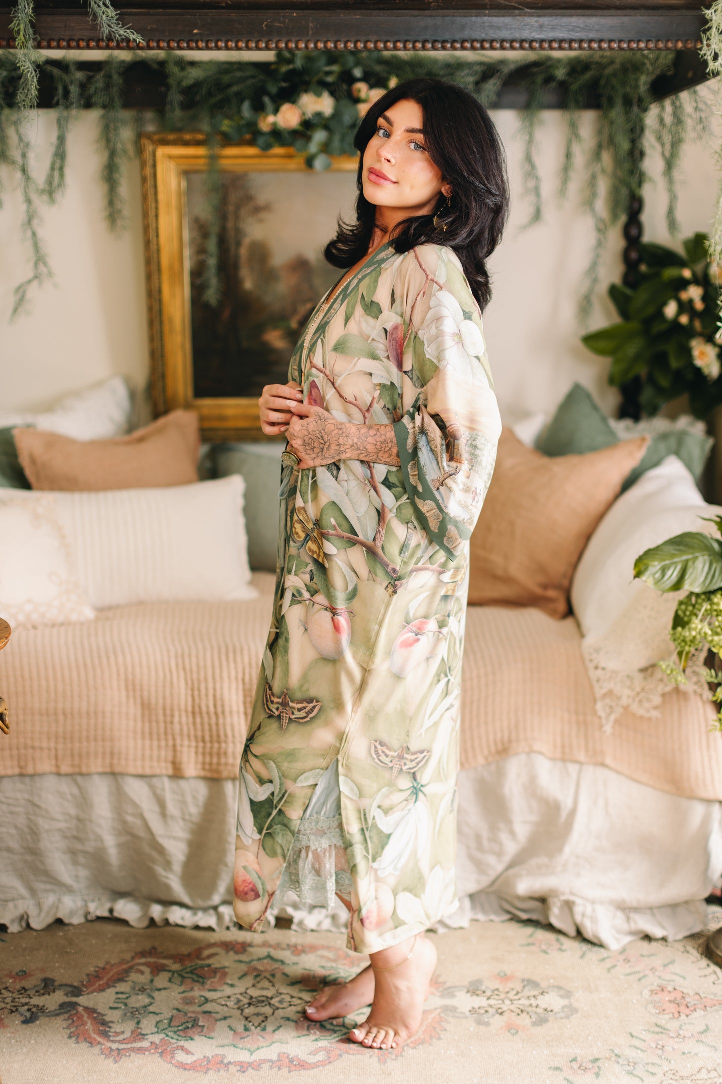 Model wearing a full-length duster robe inspired by antique florals, butterflies, and sunlit gardens, this flowing duster captures the warmth and magic of golden hour - Market of Stars