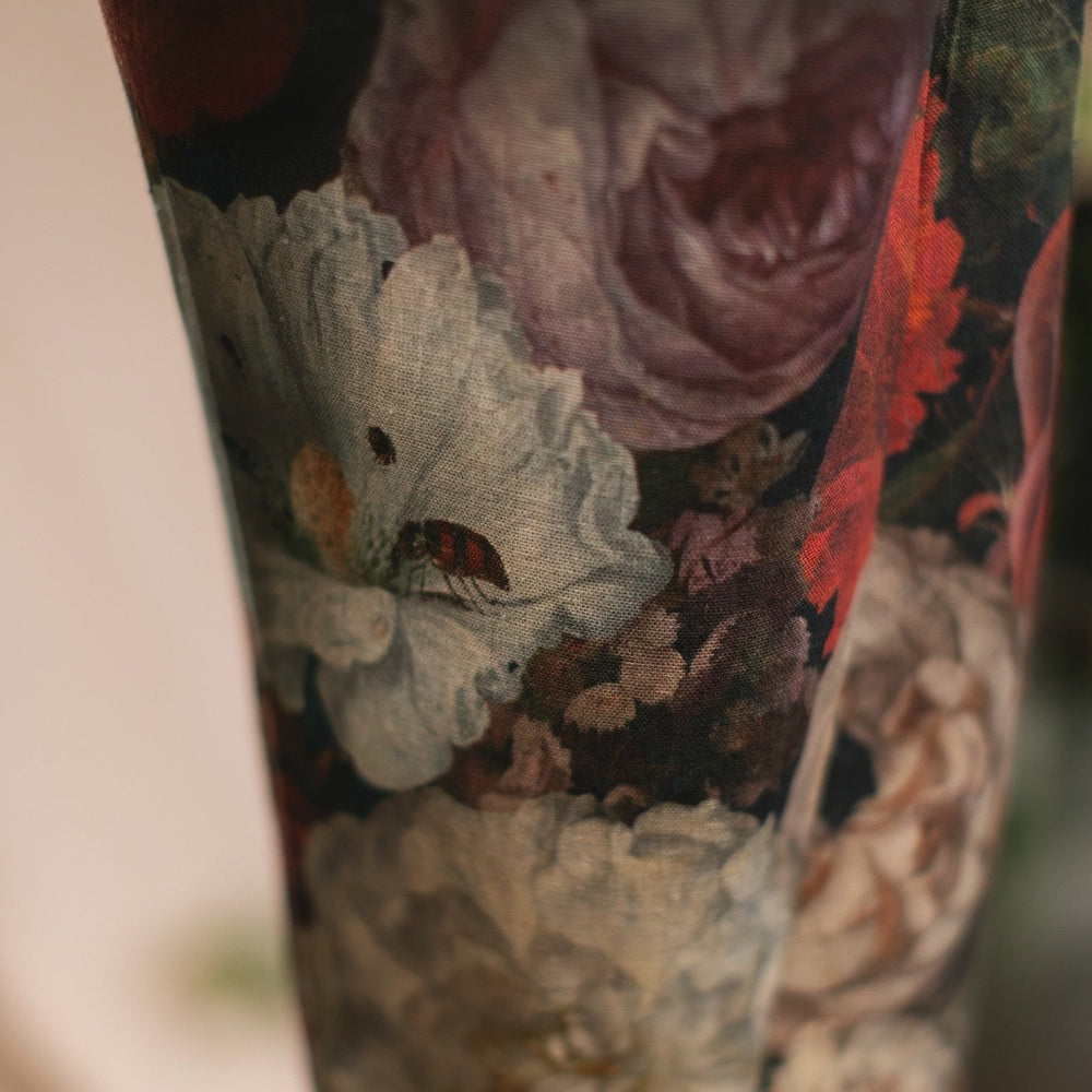 
                  
                    Model wearing the Folklore Artist Pant featuring the Bird-of-Peace embroidery and unfinished William Morris textile designs—artful linen blend pants by Market of Stars.
                  
                