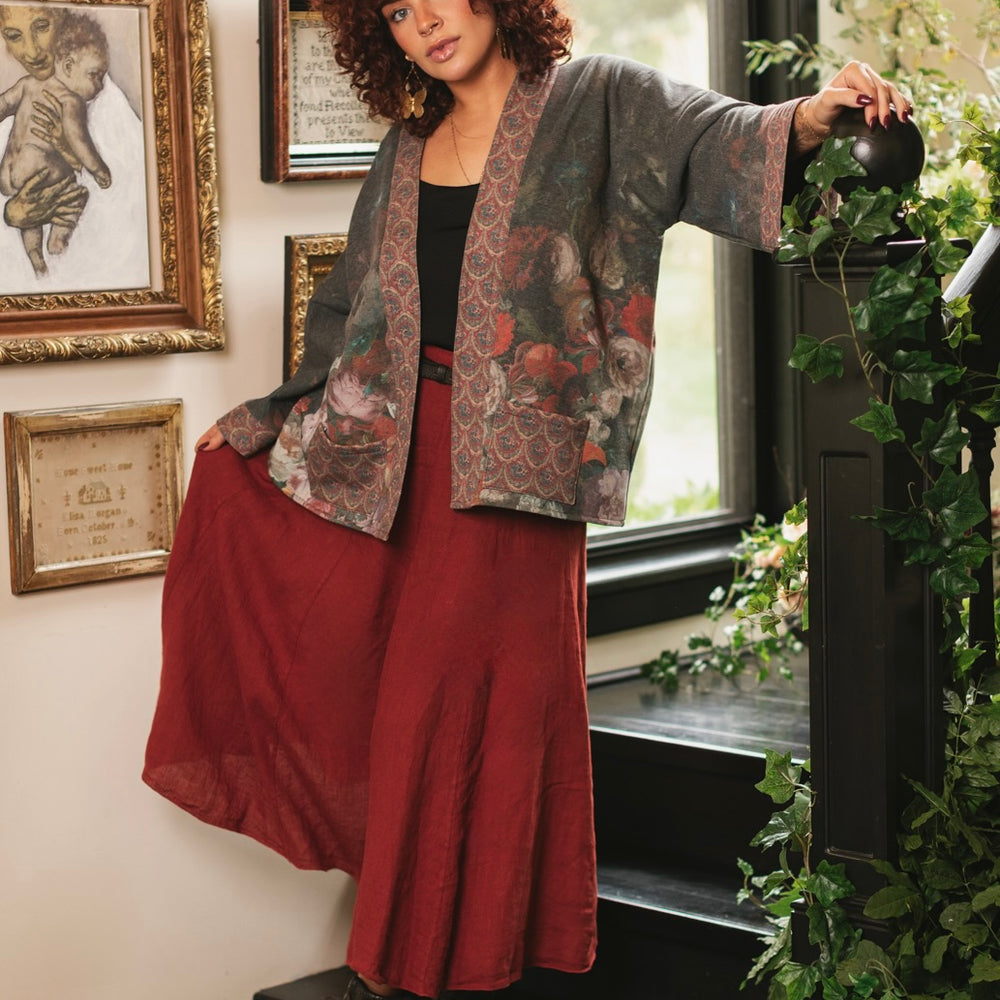 
                  
                    Model wearing a cozy cardigan lined with fleece showcasing hummingbirds and 1700s floral paintings - Market of Stars
                  
                