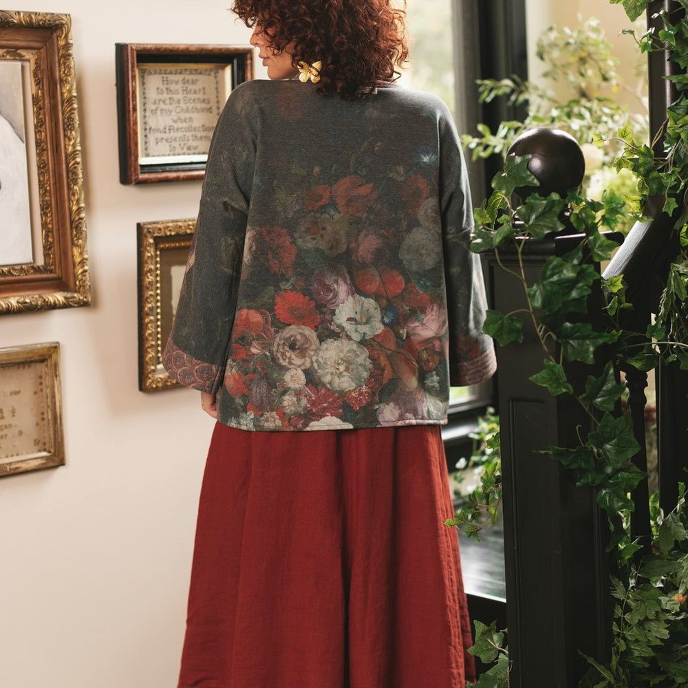 
                  
                    Model wearing a cozy cardigan lined with fleece showcasing hummingbirds and 1700s floral paintings - Market of Stars
                  
                