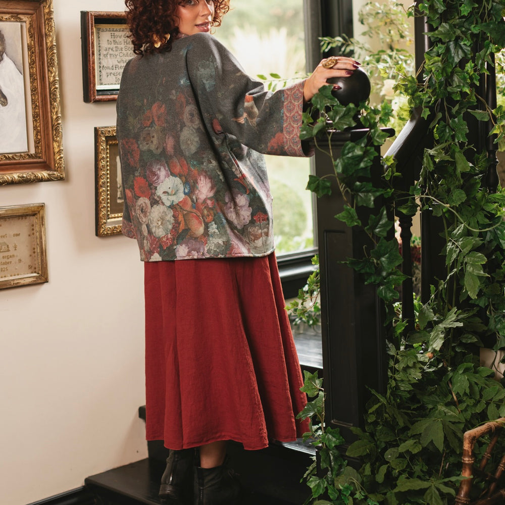 
                  
                    Model wearing a cozy cardigan lined with fleece showcasing hummingbirds and 1700s floral paintings - Market of Stars
                  
                