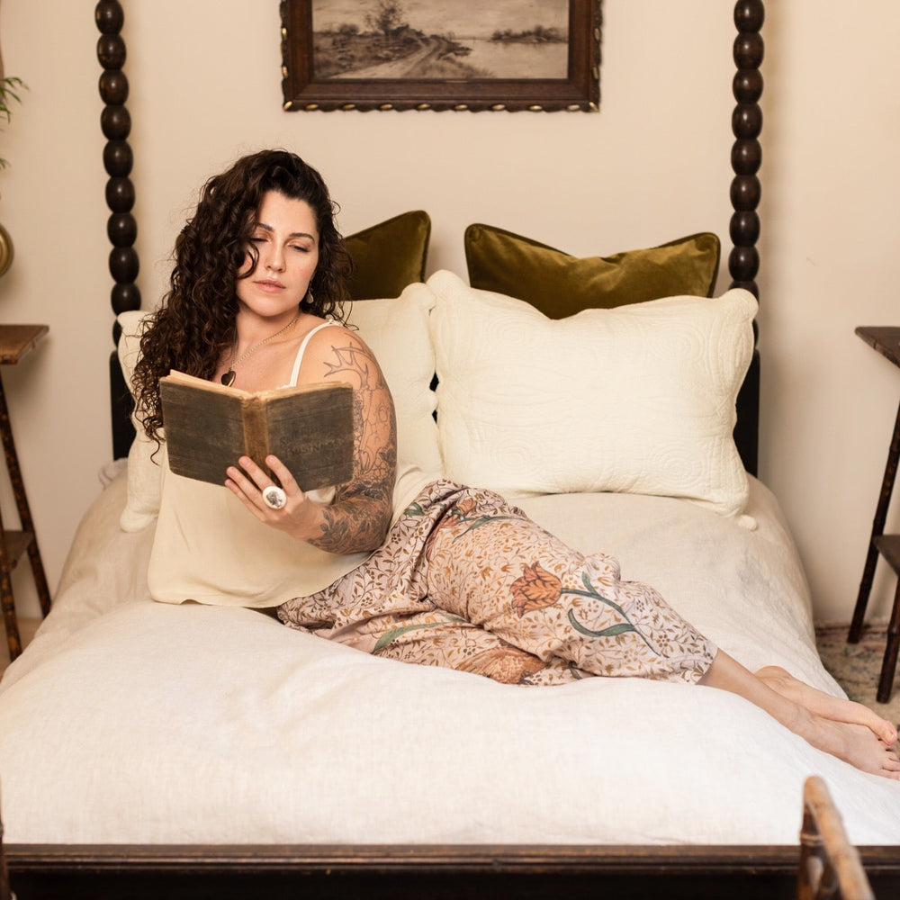 
                  
                    Model wearing Folklore Artist Pants featuring hand-stitched Bird-of-Peace embroidery and unfinished William Morris artwork celebrating the beauty of the artistic process – Market of Stars.
                  
                