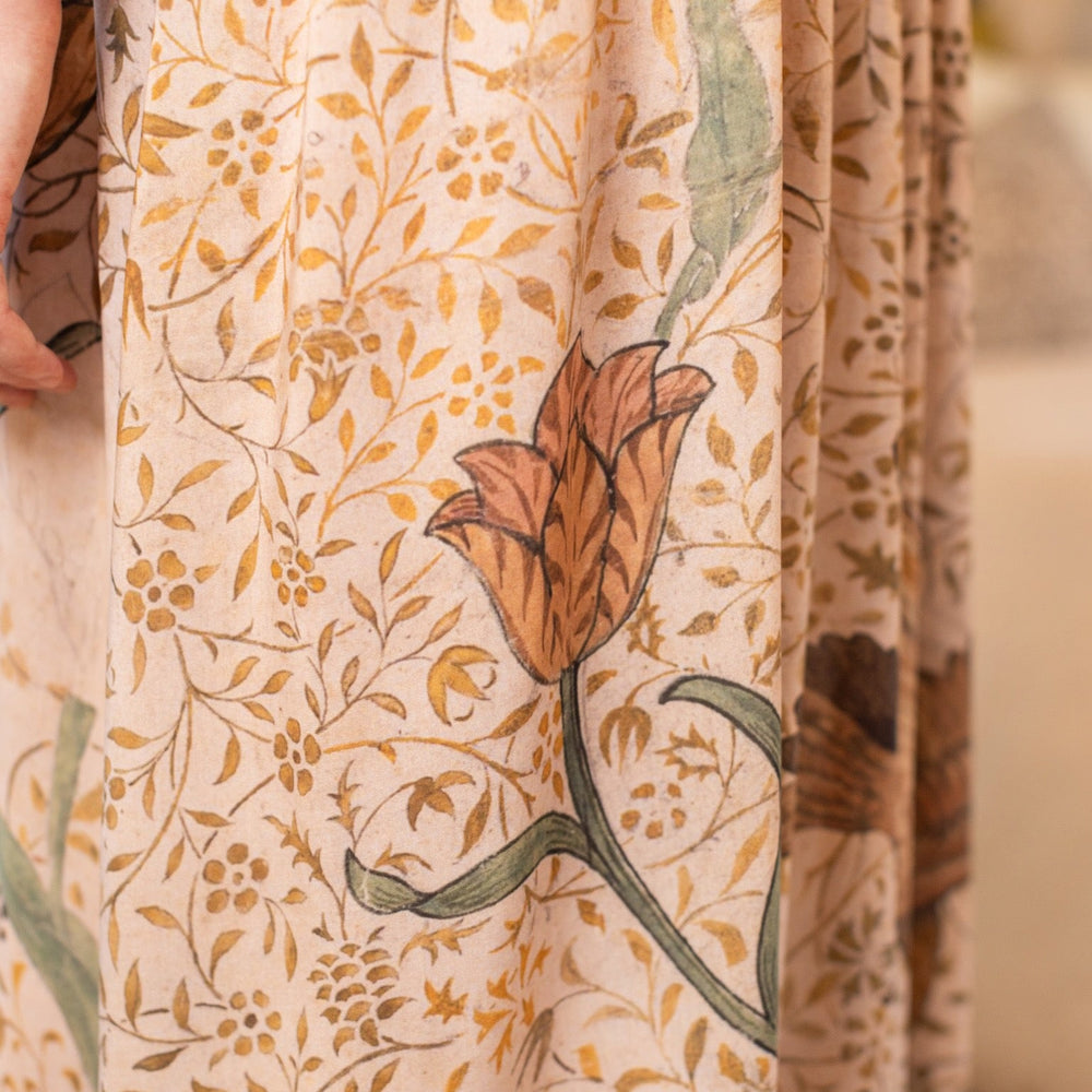 
                  
                    Model wearing Folklore Boheme slip dress featuring Bird-of-Peace embroidery and unfinished William Morris artwork in earthy romantic tones – Market of Stars.
                  
                
