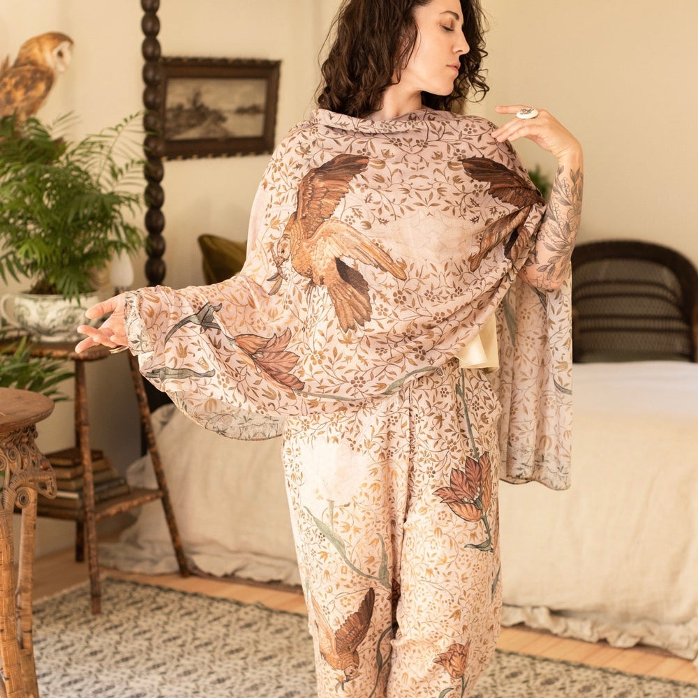 
                  
                    Model wearing soft bamboo viscose scarf featuring embroidered Bird-of-Peace and unfinished William Morris artwork inspired by the Arts and Crafts movement – Market of Stars.
                  
                