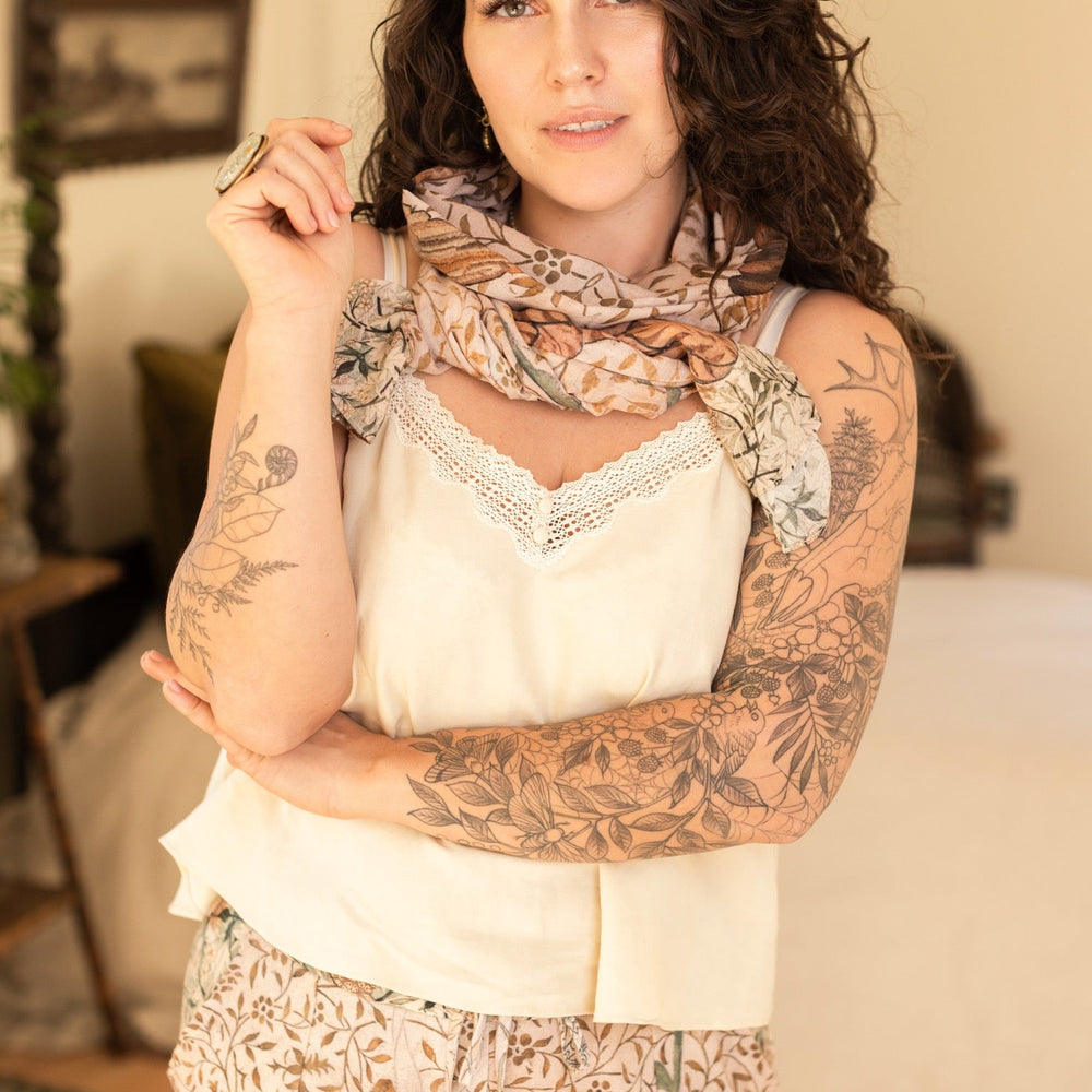 
                  
                    Model wearing soft bamboo viscose scarf featuring embroidered Bird-of-Peace and unfinished William Morris artwork inspired by the Arts and Crafts movement – Market of Stars.
                  
                