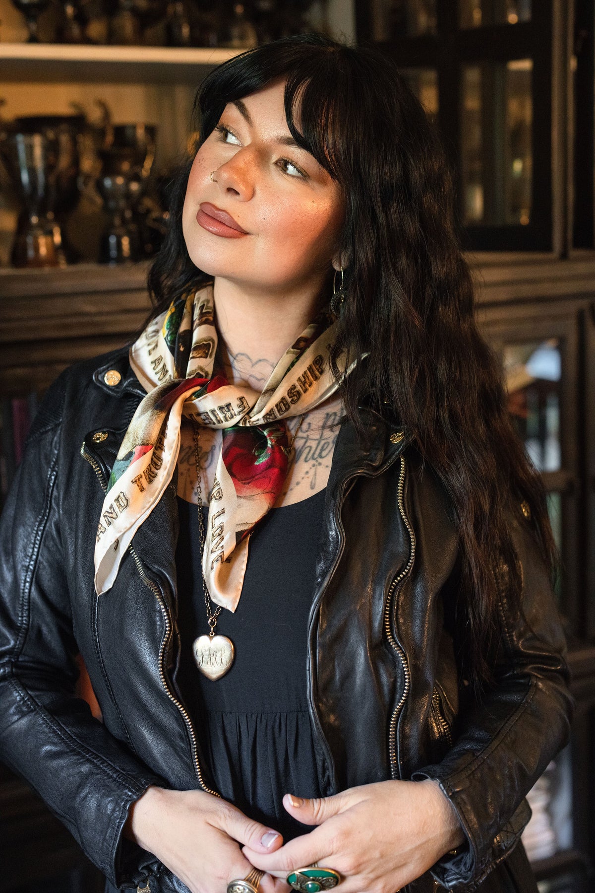 Model wearing a romantic silk scarf featuring historic symbols of love, truth, and friendship - Market of Stars