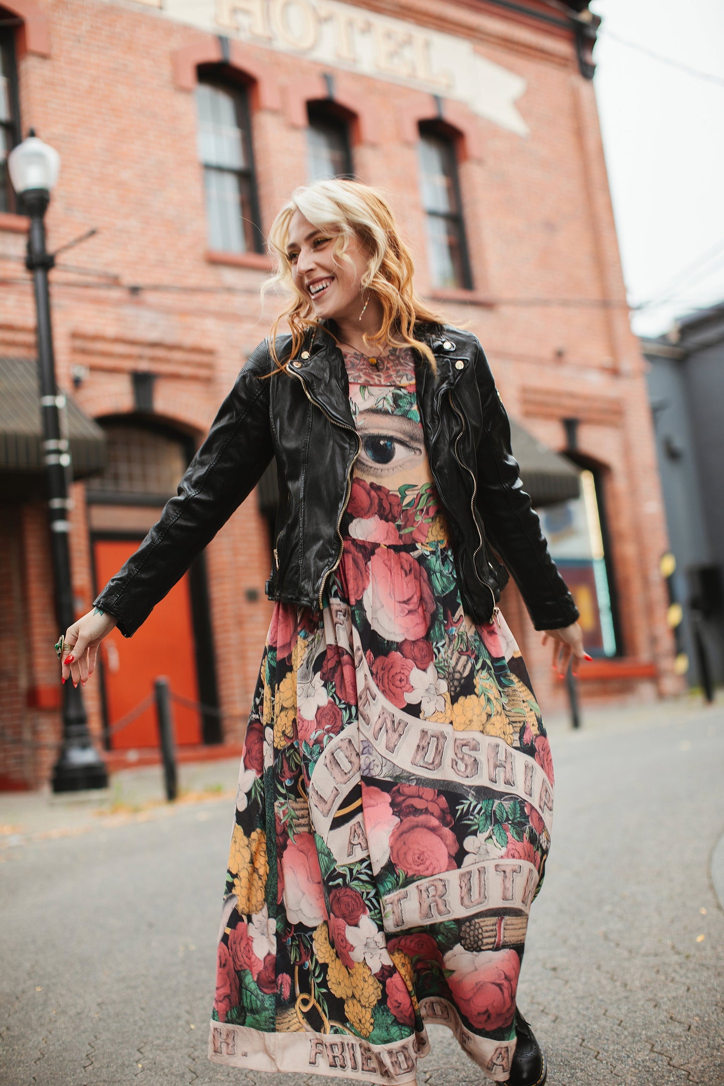 Model wearing reversible bamboo viscose slip dress featuring vintage symbols of friendship, love, and truth with pink and rose palette – Market of Stars.