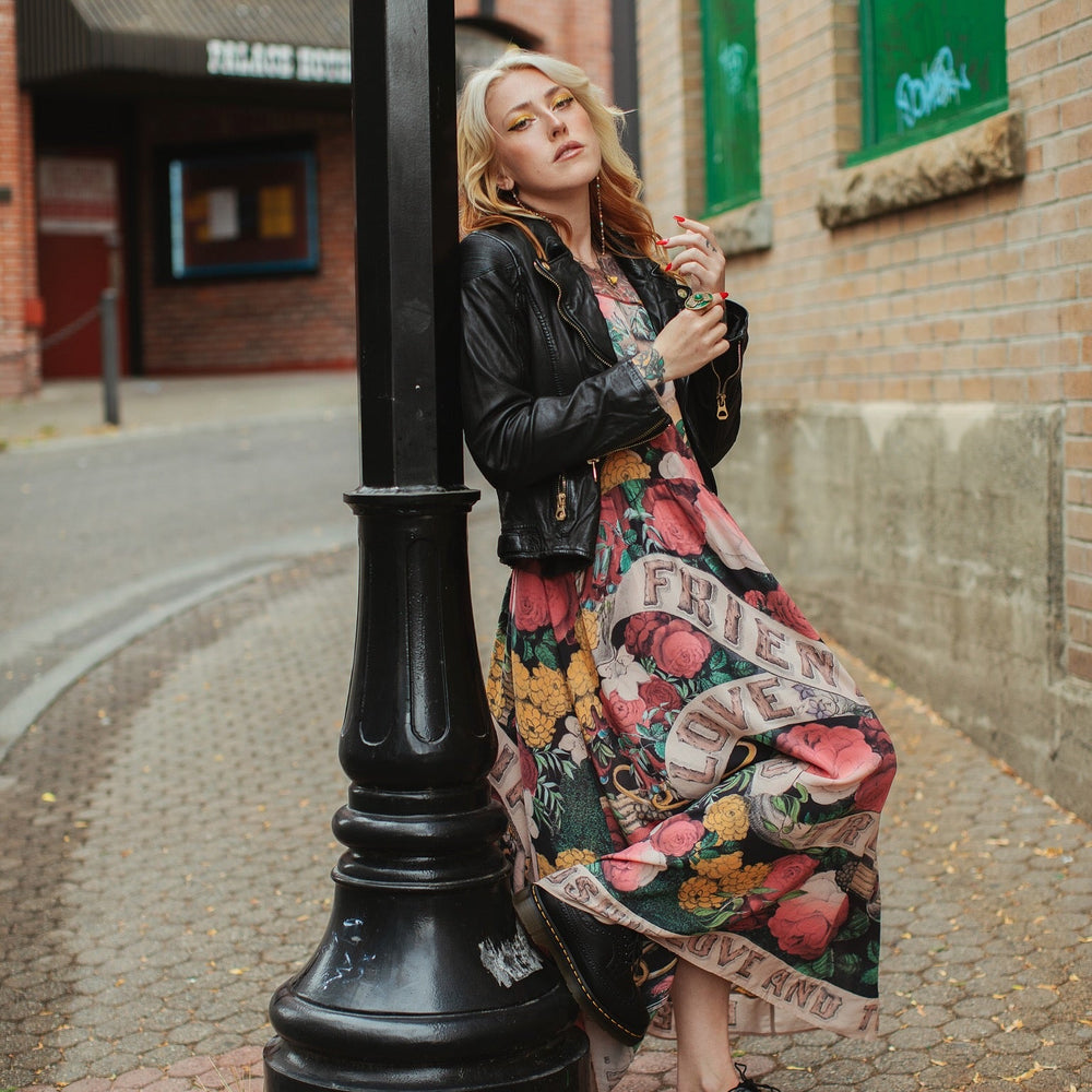 
                  
                    Model wearing reversible bamboo viscose slip dress featuring vintage symbols of friendship, love, and truth with pink and rose palette – Market of Stars.
                  
                