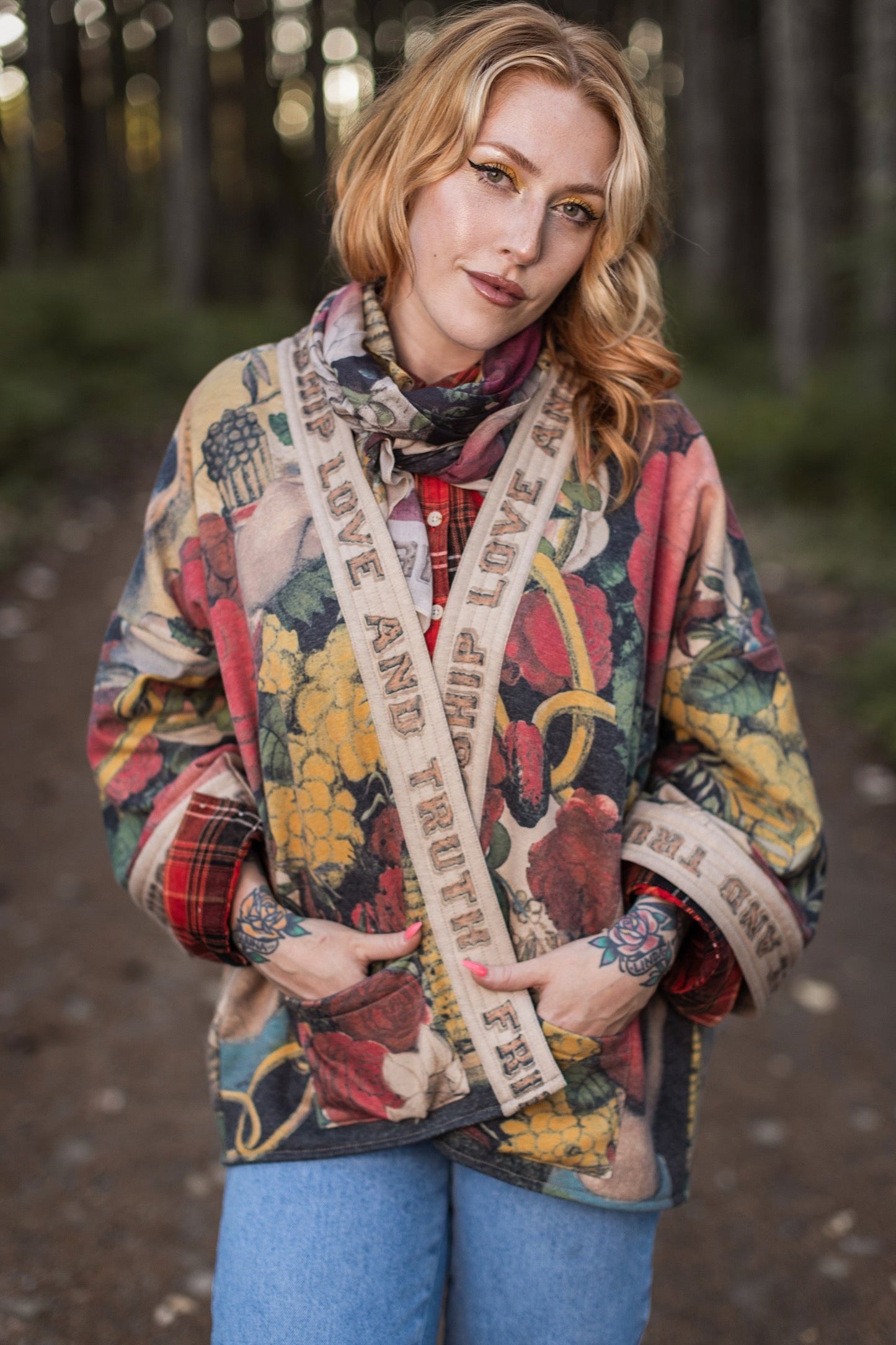 Model wearing cozy printed cardigan with vintage symbols of love, truth, and friendship, featuring charming wood-grain trim and patch pockets – Market of Stars.