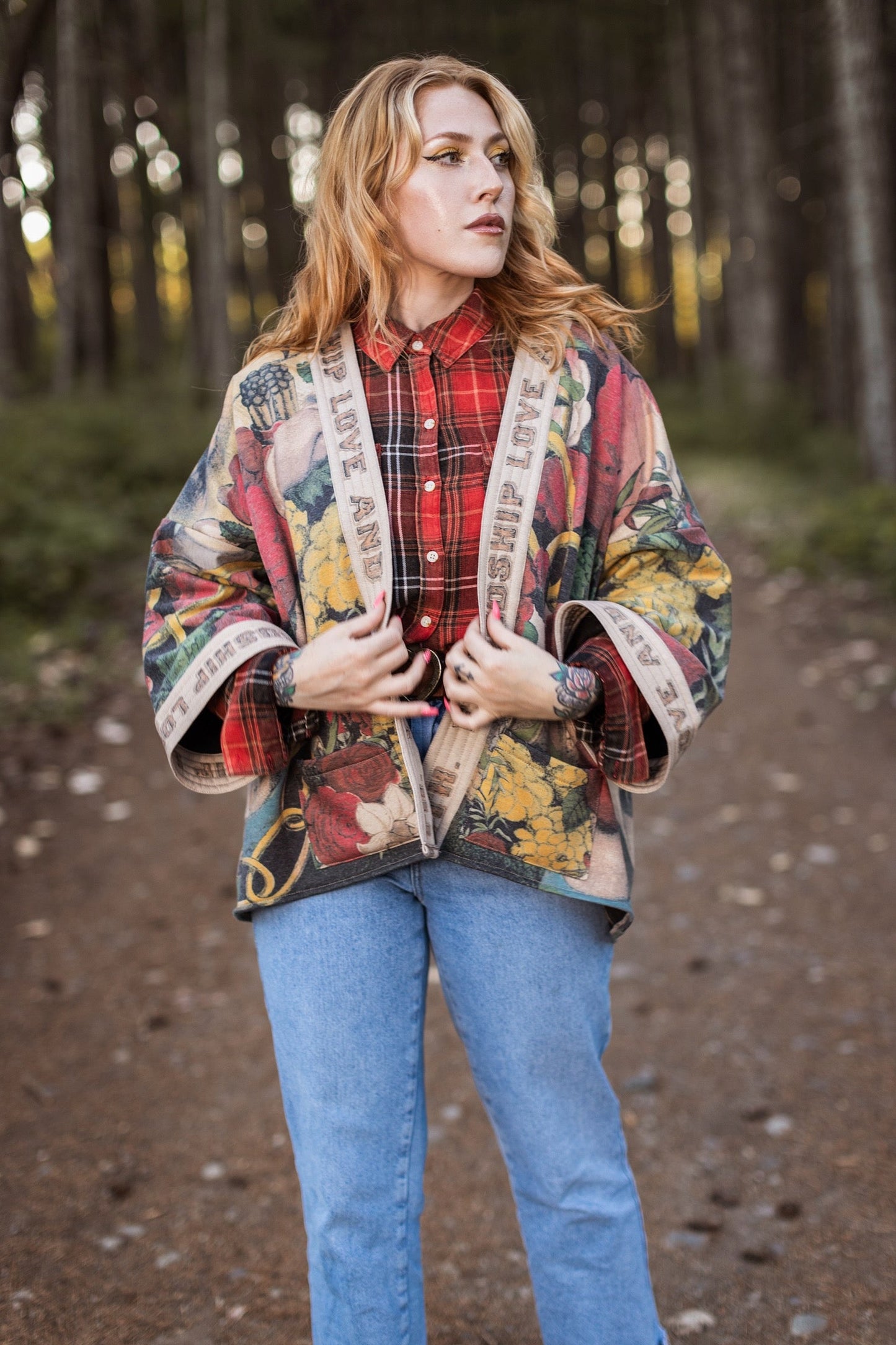 Model wearing cozy printed cardigan with vintage symbols of love, truth, and friendship, featuring charming wood-grain trim and patch pockets – Market of Stars.