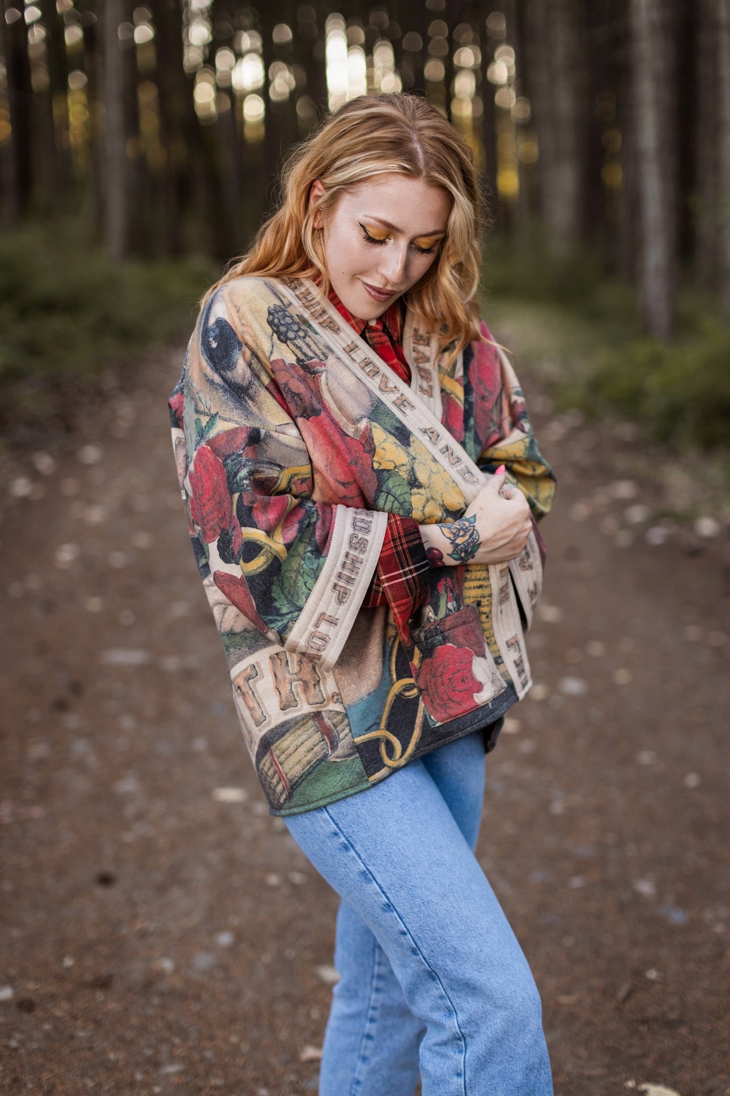Model wearing cozy printed cardigan with vintage symbols of love, truth, and friendship, featuring charming wood-grain trim and patch pockets – Market of Stars.
