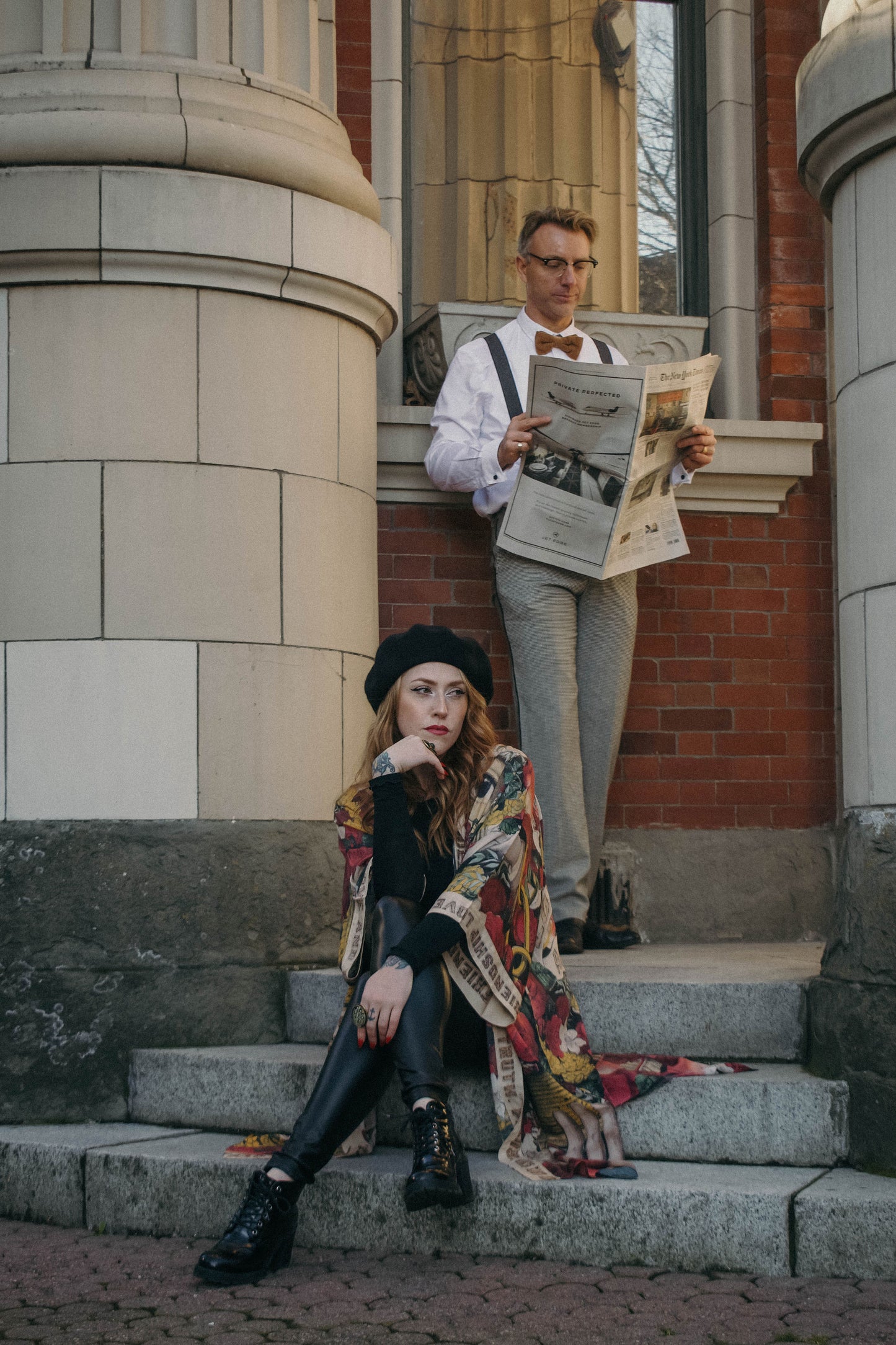 Model wearing our long, eclectic opera duster featuring vintage symbols of love, kindness, and truth in a bold archive-inspired print with removable belt – Market of Stars.
