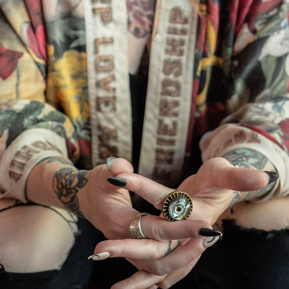 
                  
                    Model wearing our cropped kimono featuring historic symbols of friendship, love, and truth with archive-inspired wood-grain trim and romantic vintage details – Market of Stars.
                  
                