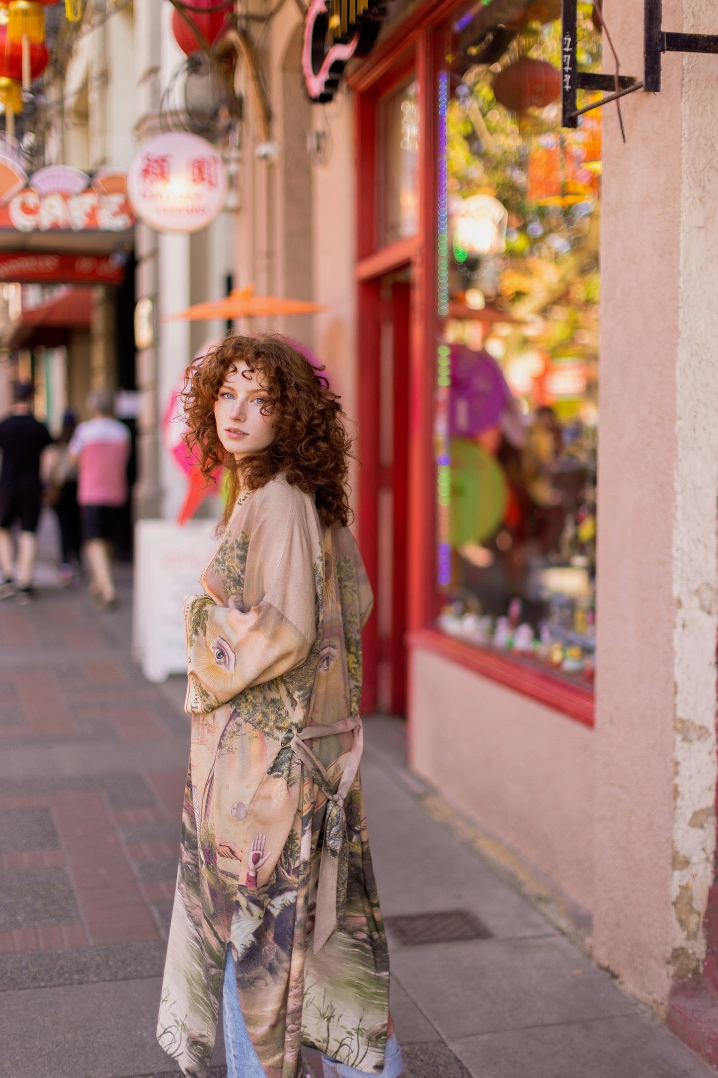 Model wearing sun-washed vintage-inspired Opera Duster featuring symbols of friendship, love, and truth in soft lavender, sage, gold, and aqua – Market of Stars
