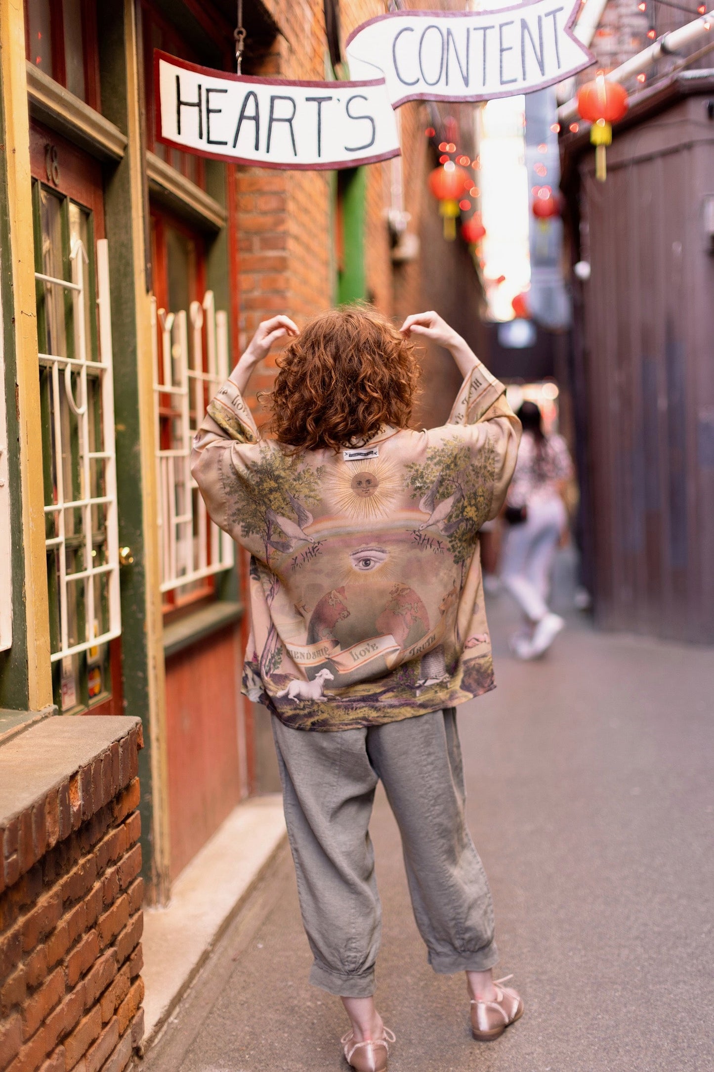 Vintage-inspired cropped kimono featuring historic symbols of friendship, love, and truth in a soft sun-washed palette of lavender, sage, gold, and aqua – Market of Stars.