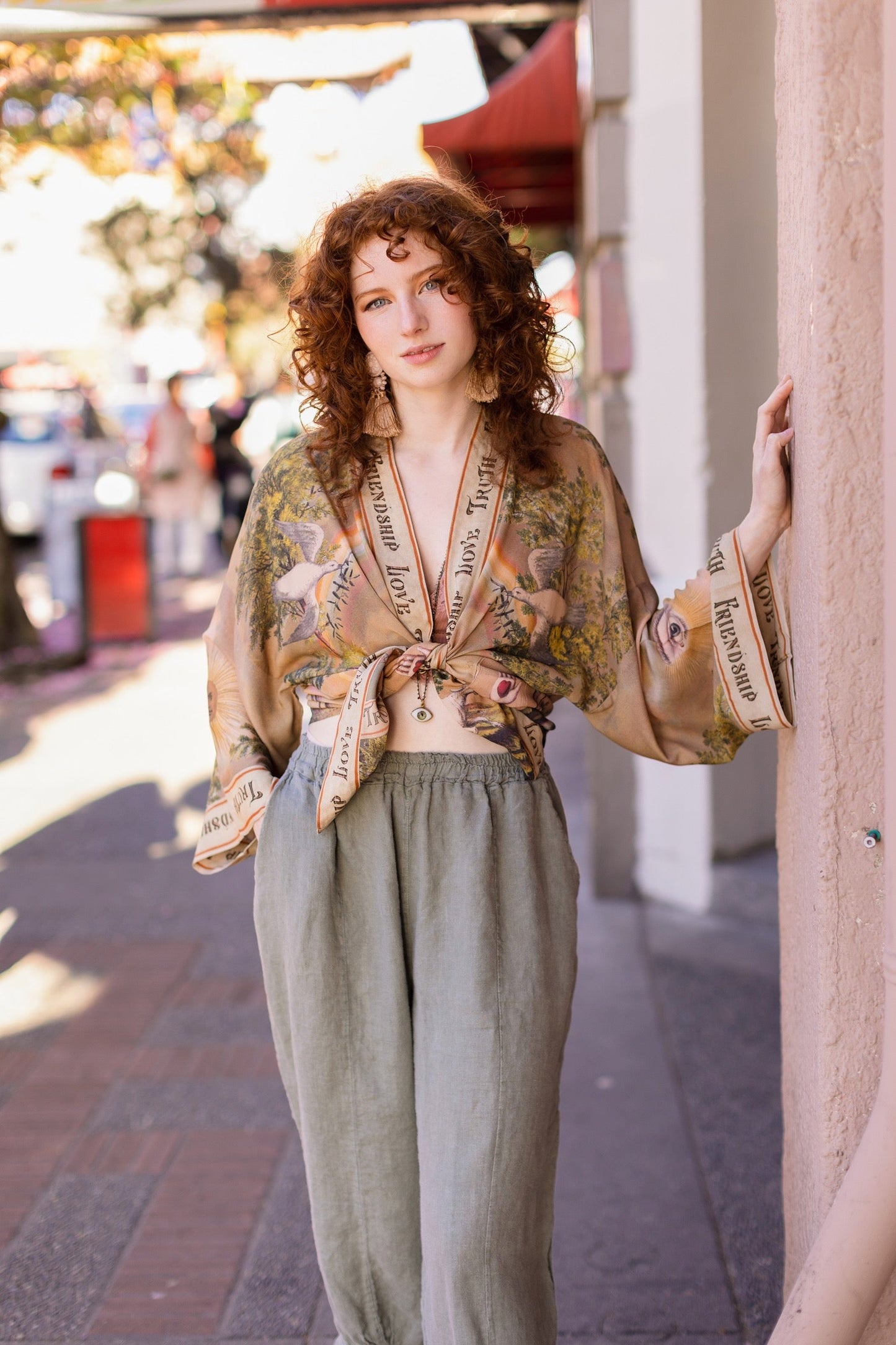 Vintage-inspired cropped kimono featuring historic symbols of friendship, love, and truth in a soft sun-washed palette of lavender, sage, gold, and aqua – Market of Stars.