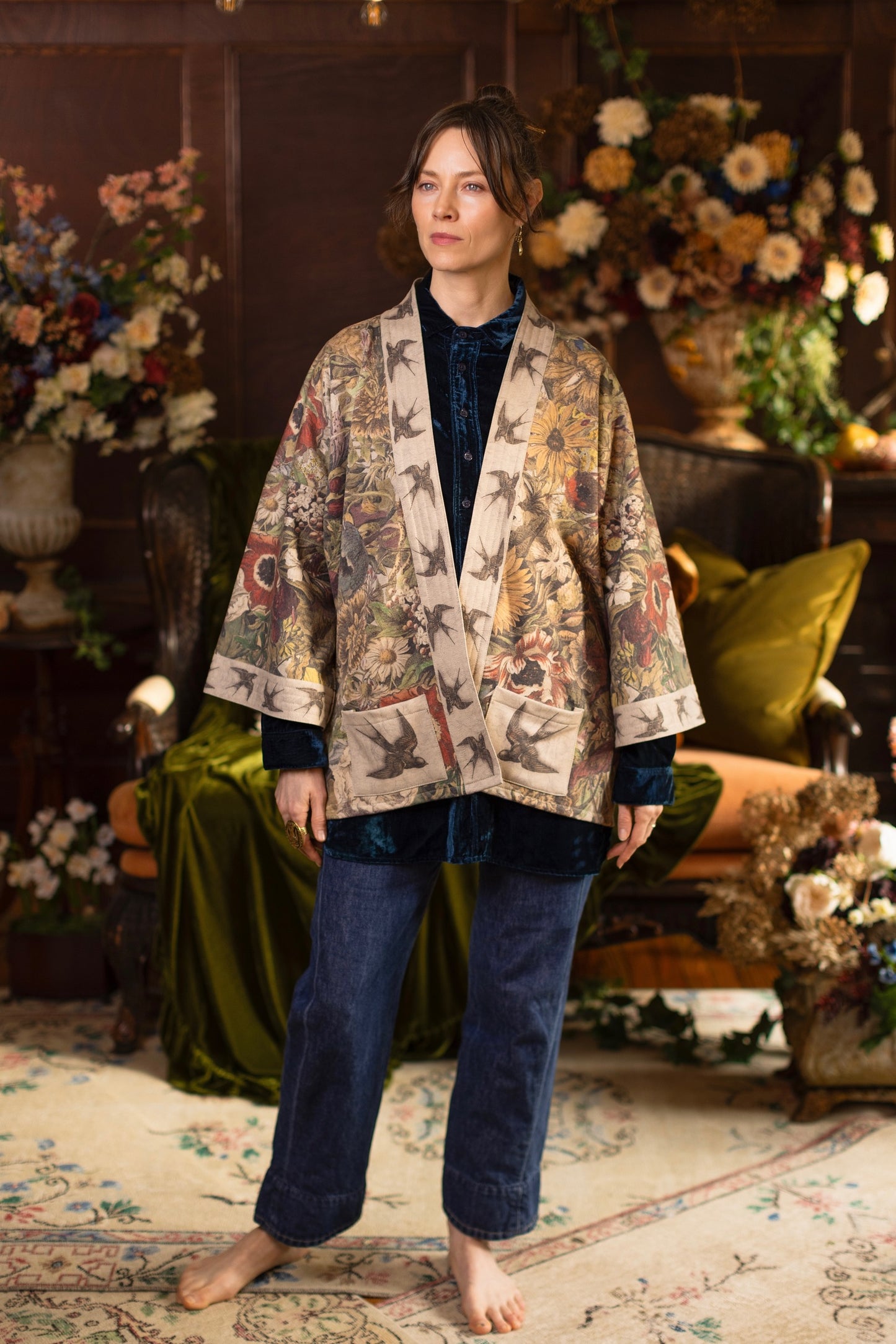 Model wearing a soft fleece cottage cardigan featuring rich 1700s botanical blooms and swallow trim - Market of Stars