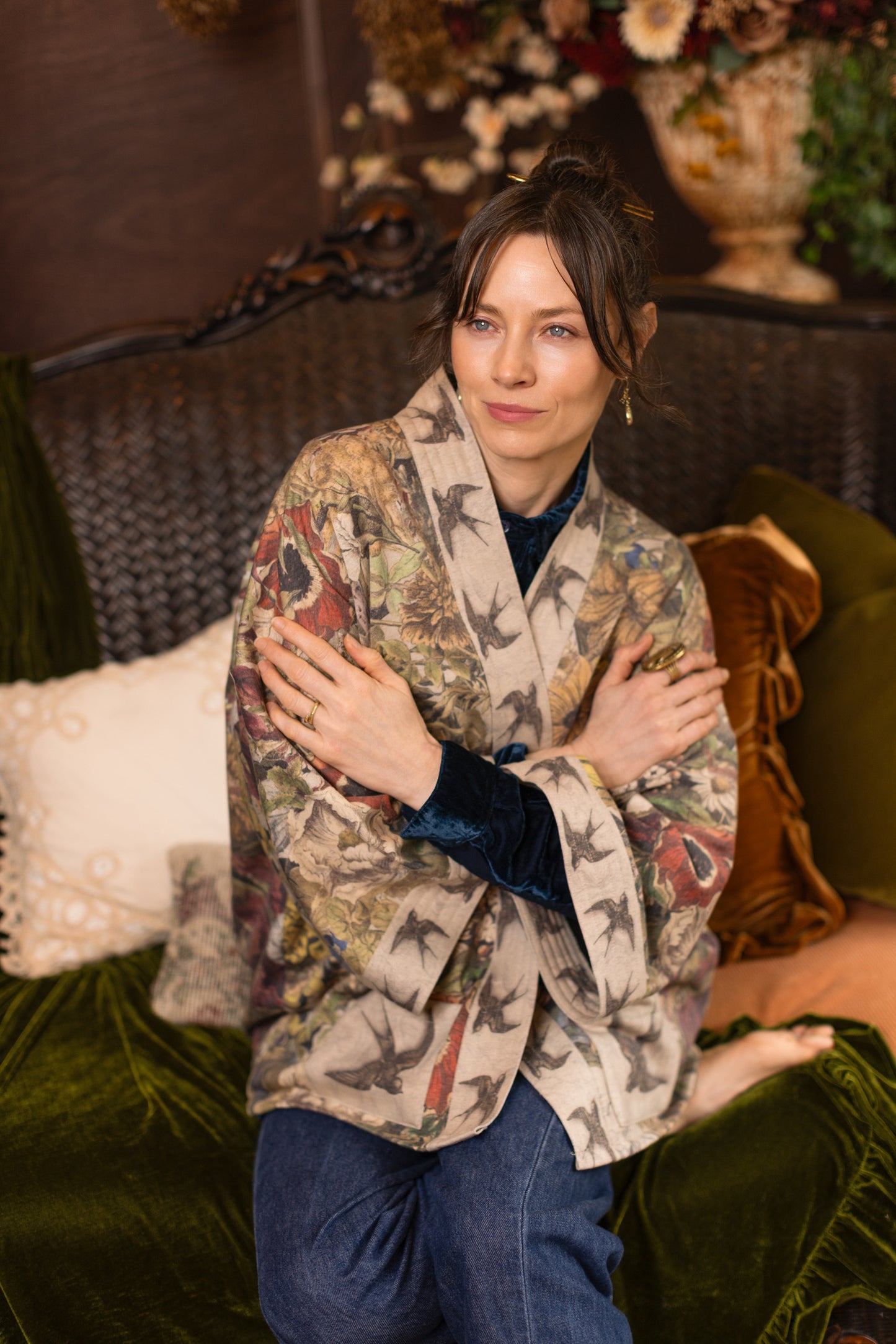Model wearing a soft fleece cottage cardigan featuring rich 1700s botanical blooms and swallow trim - Market of Stars