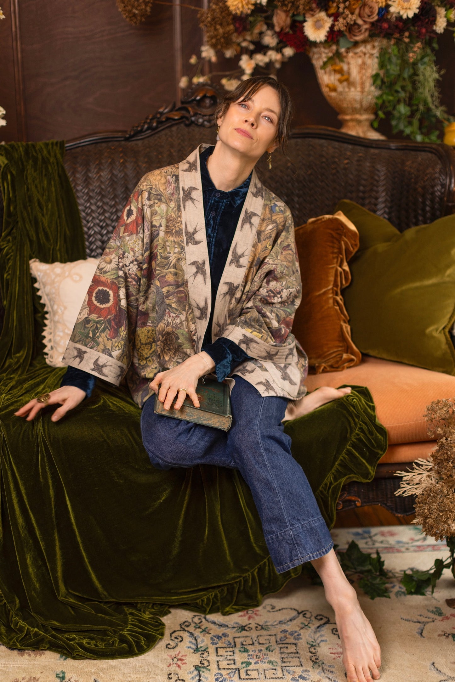 Model wearing a soft fleece cottage cardigan featuring rich 1700s botanical blooms and swallow trim - Market of Stars