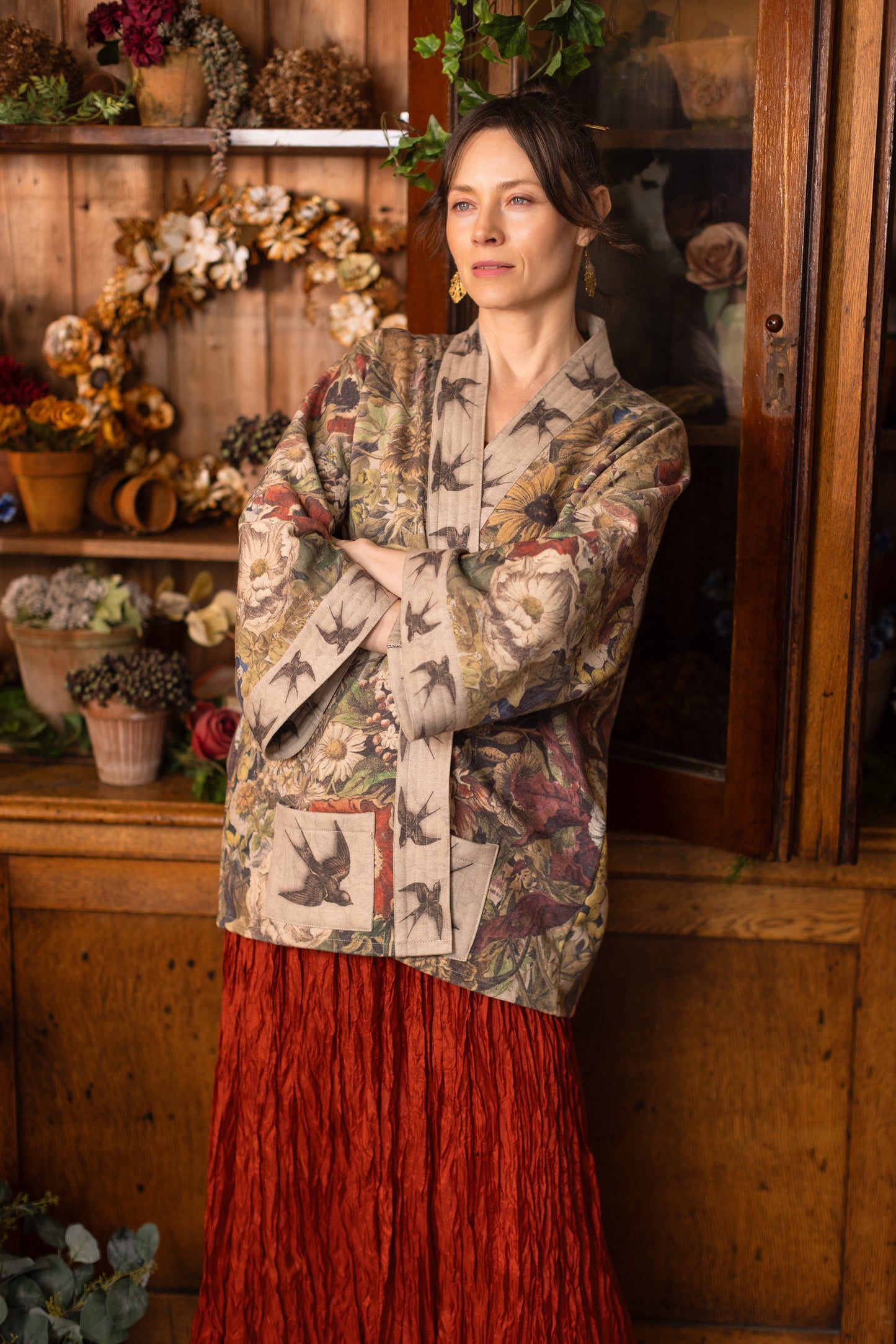Model wearing a soft fleece cottage cardigan featuring rich 1700s botanical blooms and swallow trim - Market of Stars