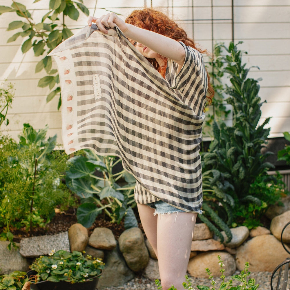 Model wearing Happy Days scarf featuring heritage gingham, vintage strawberries, and a cross-stitch patch inspired by an 1836 sampler – Market of Stars.