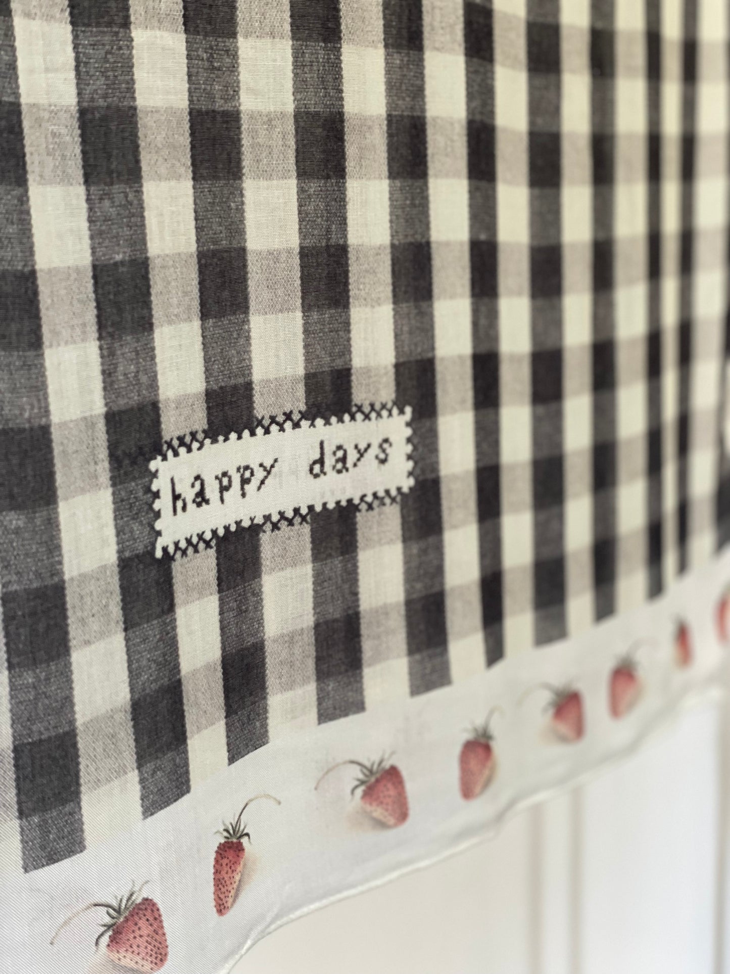 Model wearing Happy Days scarf featuring heritage gingham, vintage strawberries, and a cross-stitch patch inspired by an 1836 sampler – Market of Stars.