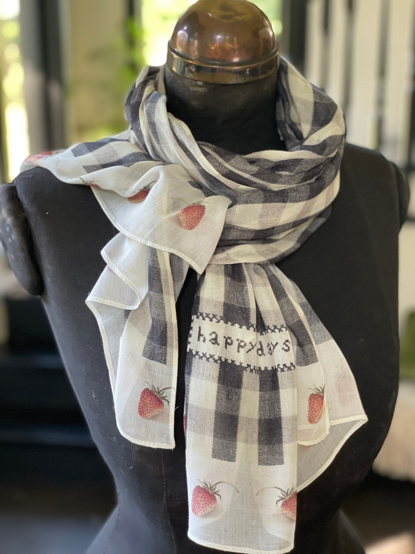 Model wearing Happy Days scarf featuring heritage gingham, vintage strawberries, and a cross-stitch patch inspired by an 1836 sampler – Market of Stars.