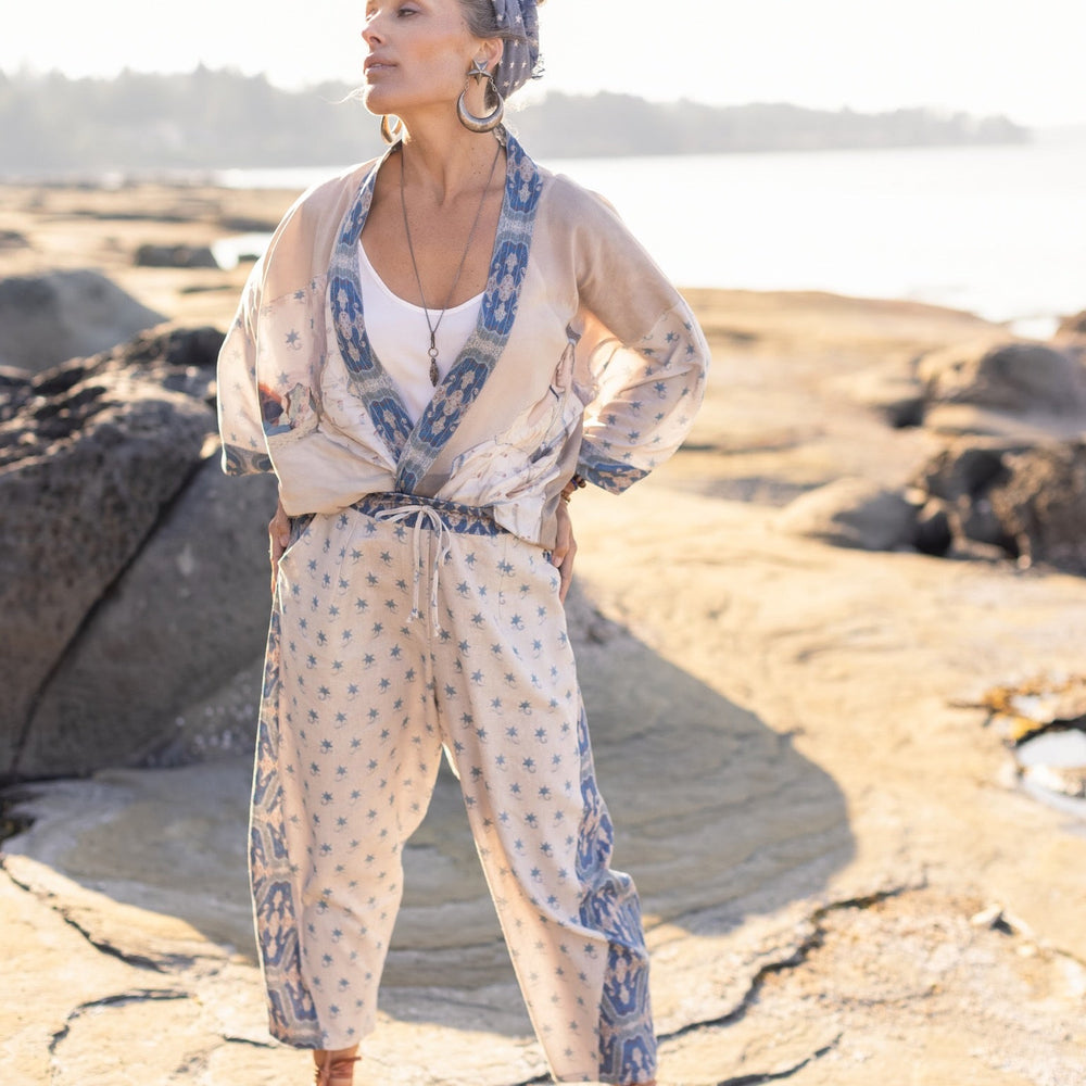 
                  
                    Model wearing Head in the Clouds Artist Pants featuring starry front panel and Turkish rug trim from Liotard’s portrait The Painter’s Wife-Market of Stars
                  
                