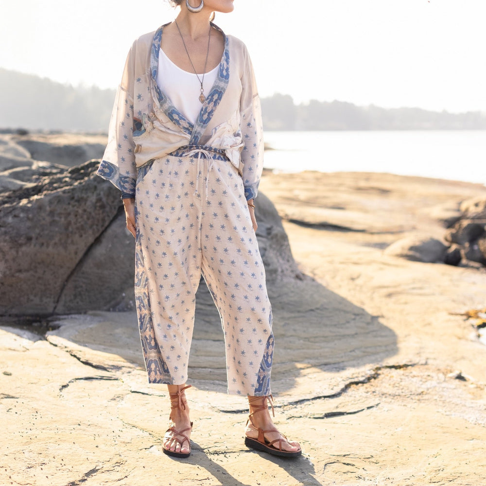 
                  
                    Model wearing Head in the Clouds Artist Pants featuring starry front panel and Turkish rug trim from Liotard’s portrait The Painter’s Wife-Market of Stars
                  
                