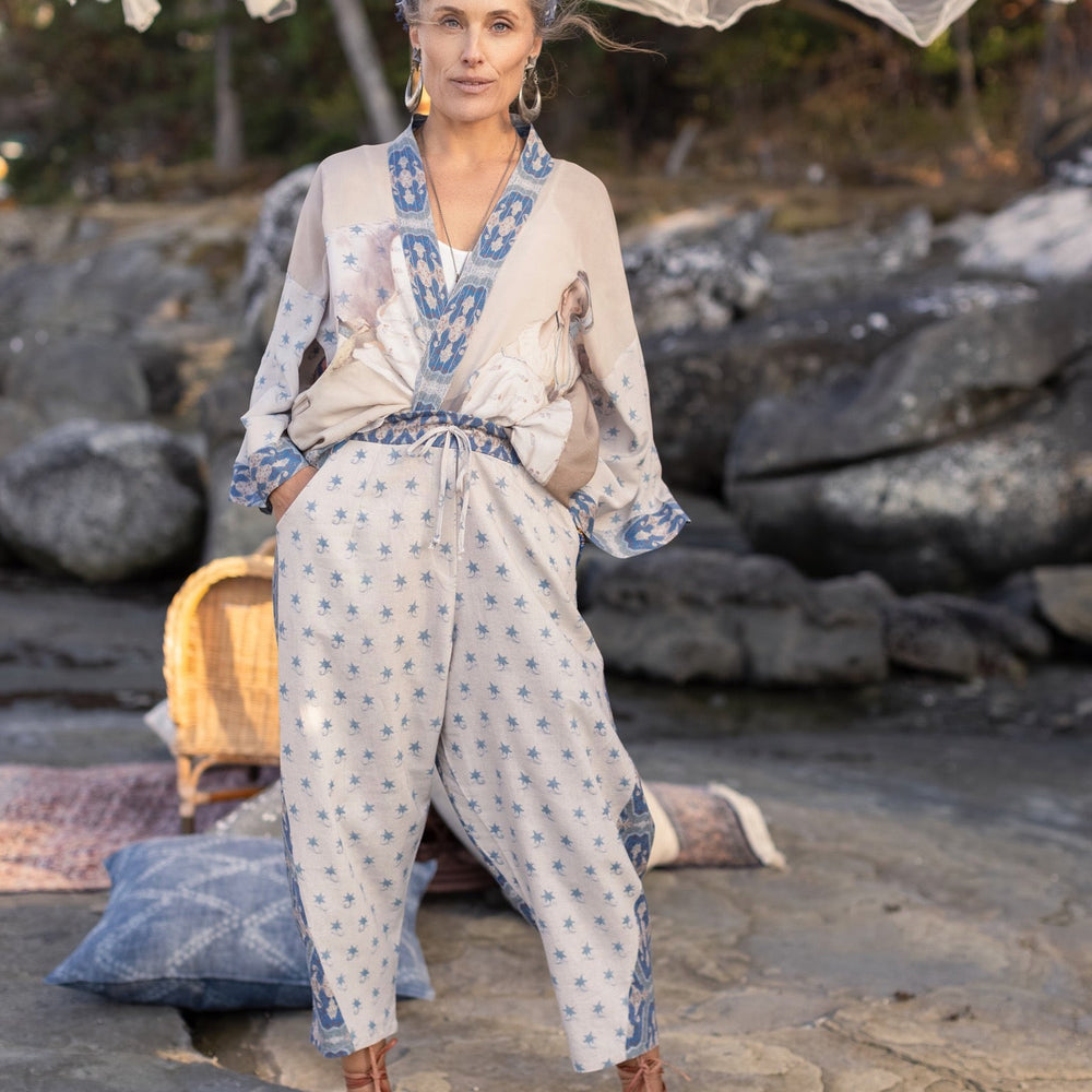 
                  
                    Model wearing Head in the Clouds Artist Pants featuring starry front panel and Turkish rug trim from Liotard’s portrait The Painter’s Wife-Market of Stars
                  
                