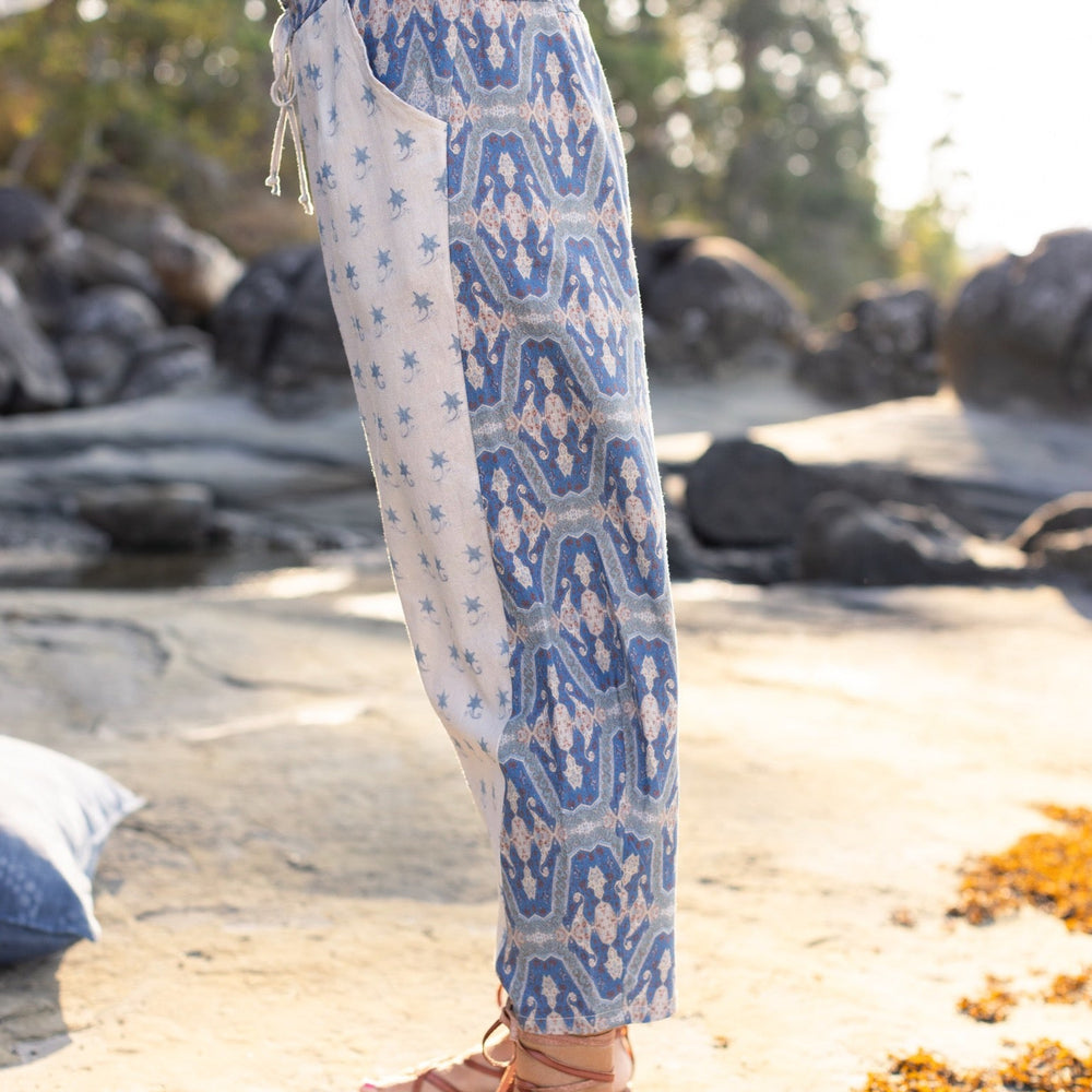 
                  
                    Model wearing Head in the Clouds Artist Pants featuring starry front panel and Turkish rug trim from Liotard’s portrait The Painter’s Wife-Market of Stars
                  
                