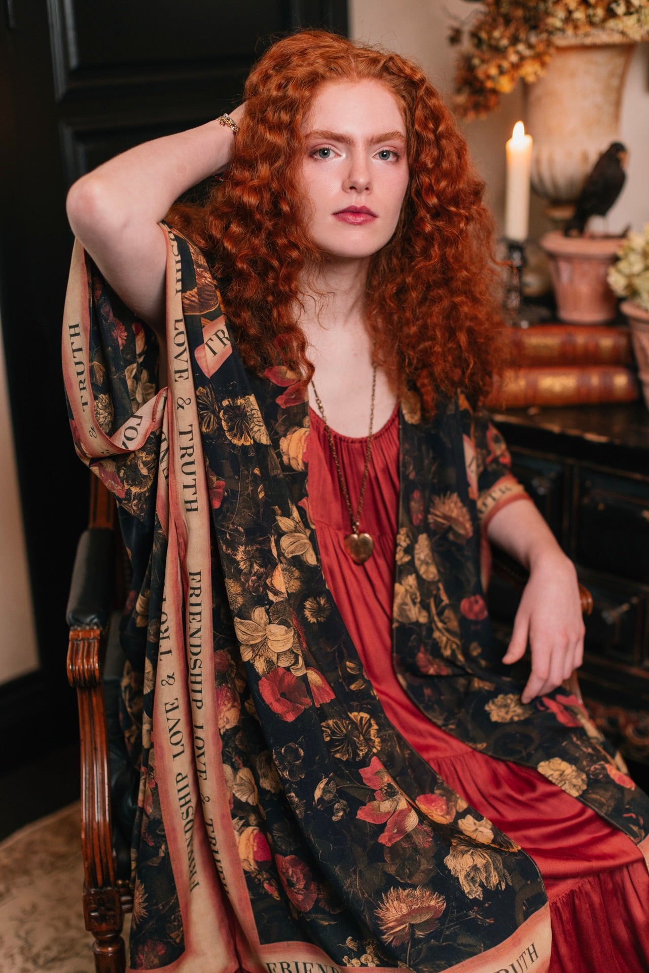 Model wearing a flowy bamboo-viscose duster featuring a collage of antique artwork with romance, loyalty, and old-world beauty - Market of Stars