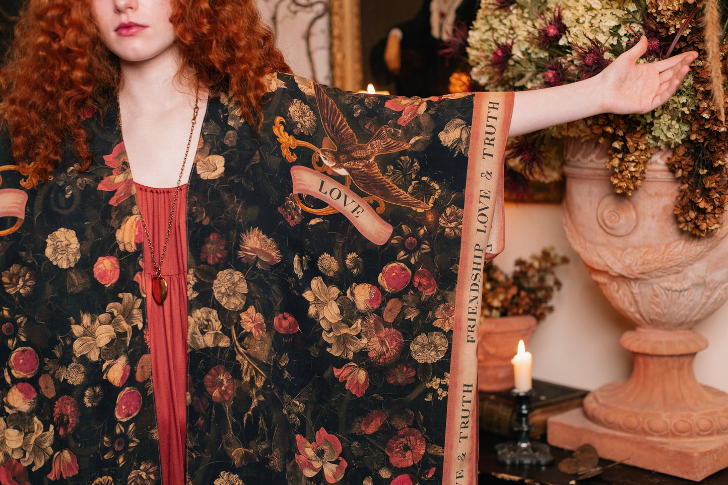 Model wearing a flowy bamboo-viscose duster featuring a collage of antique artwork with romance, loyalty, and old-world beauty - Market of Stars
