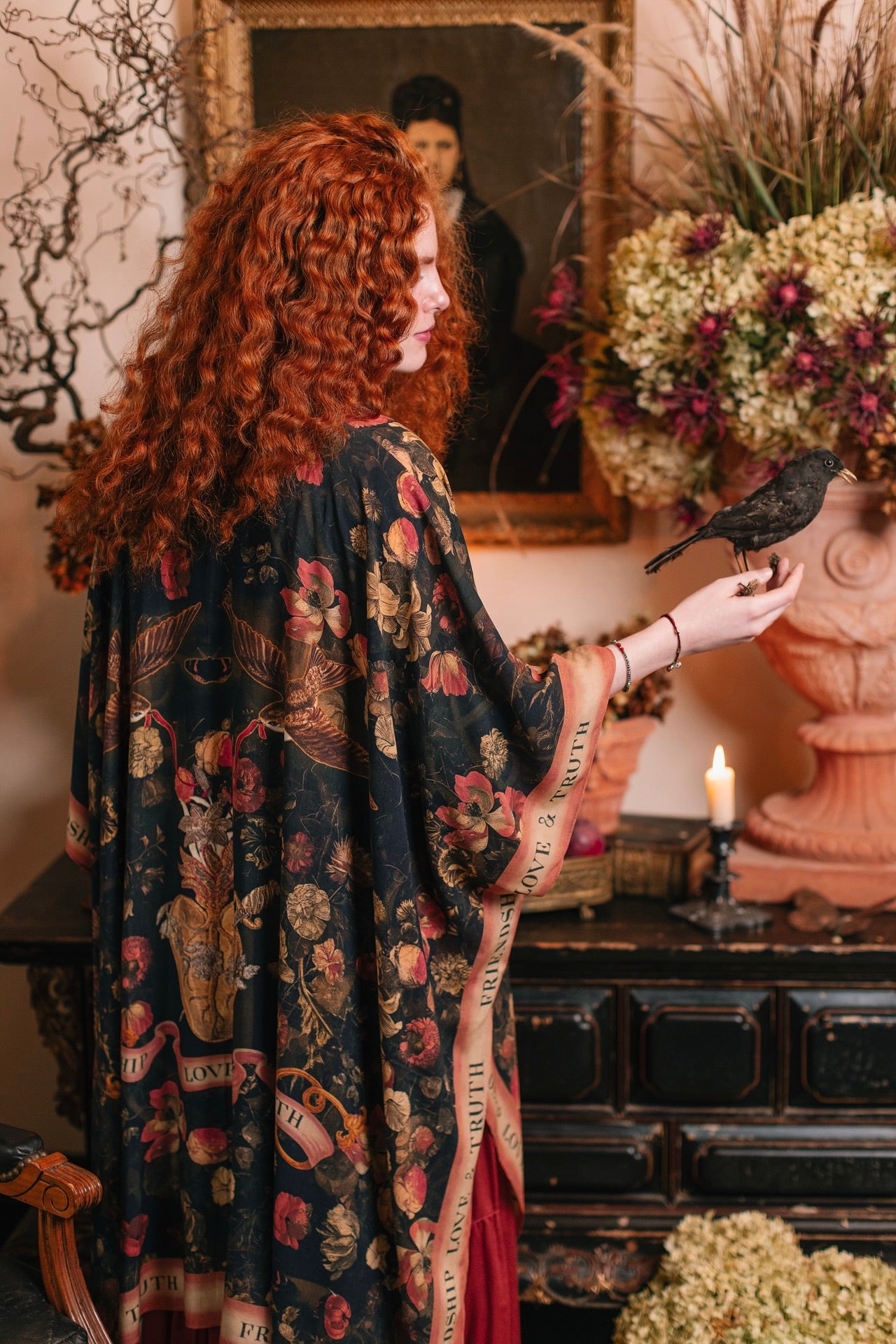 Model wearing a flowy bamboo-viscose duster featuring a collage of antique artwork with romance, loyalty, and old-world beauty - Market of Stars