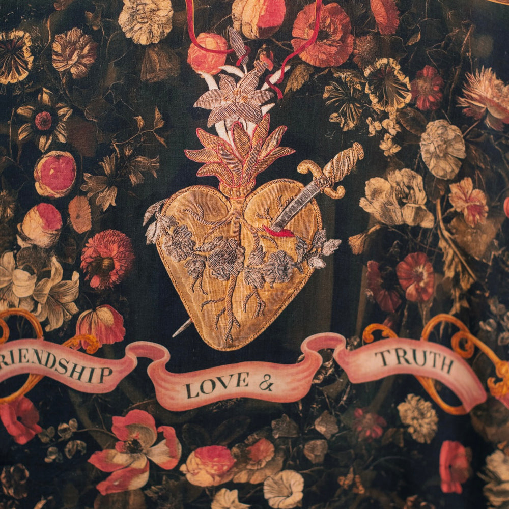 
                  
                    Model wearing a flowy bamboo-viscose duster featuring a collage of antique artwork with romance, loyalty, and old-world beauty - Market of Stars
                  
                