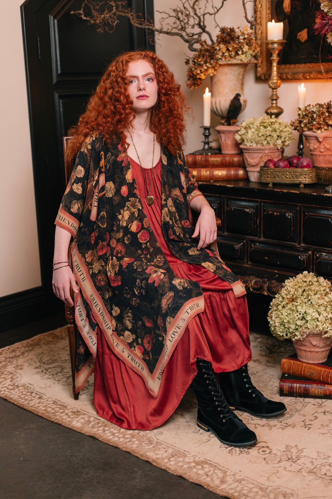 Model wearing a flowy bamboo-viscose duster featuring a collage of antique artwork with romance, loyalty, and old-world beauty - Market of Stars