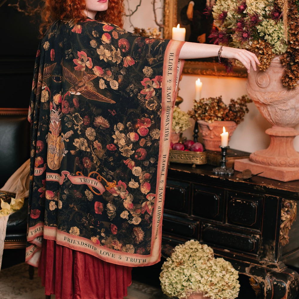 Model wearing a flowy bamboo-viscose duster featuring a collage of antique artwork with romance, loyalty, and old-world beauty - Market of Stars